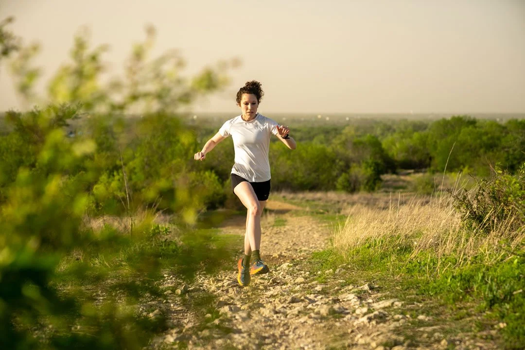 Image of Haleigh running on a trail