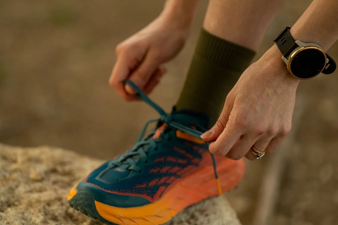 Image of someone tying a shoe.