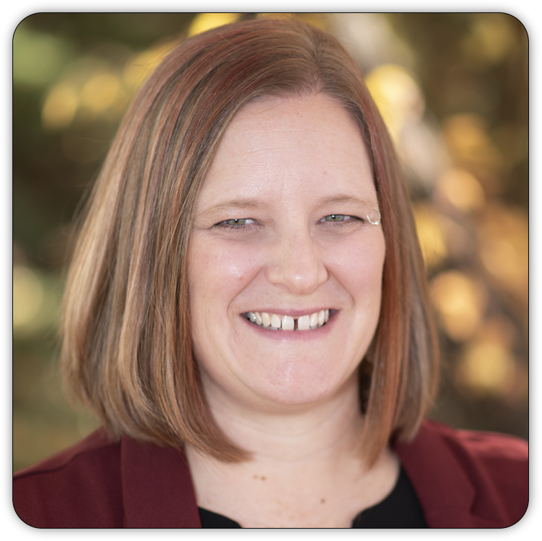 Portrait photograph of a smiling Anna Whitehall.