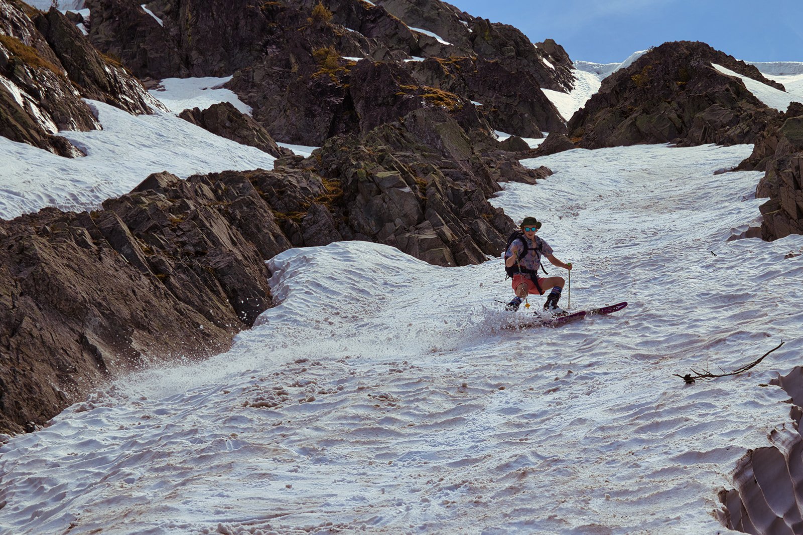 Winter, Spring or Summer? :
I love this photo of my friend skiing—it perfectly captures the contrast between the absurd and the epic. He's dressed in full summer beach attire, as if he's headed for a surf session, not dropping into a steep, technica