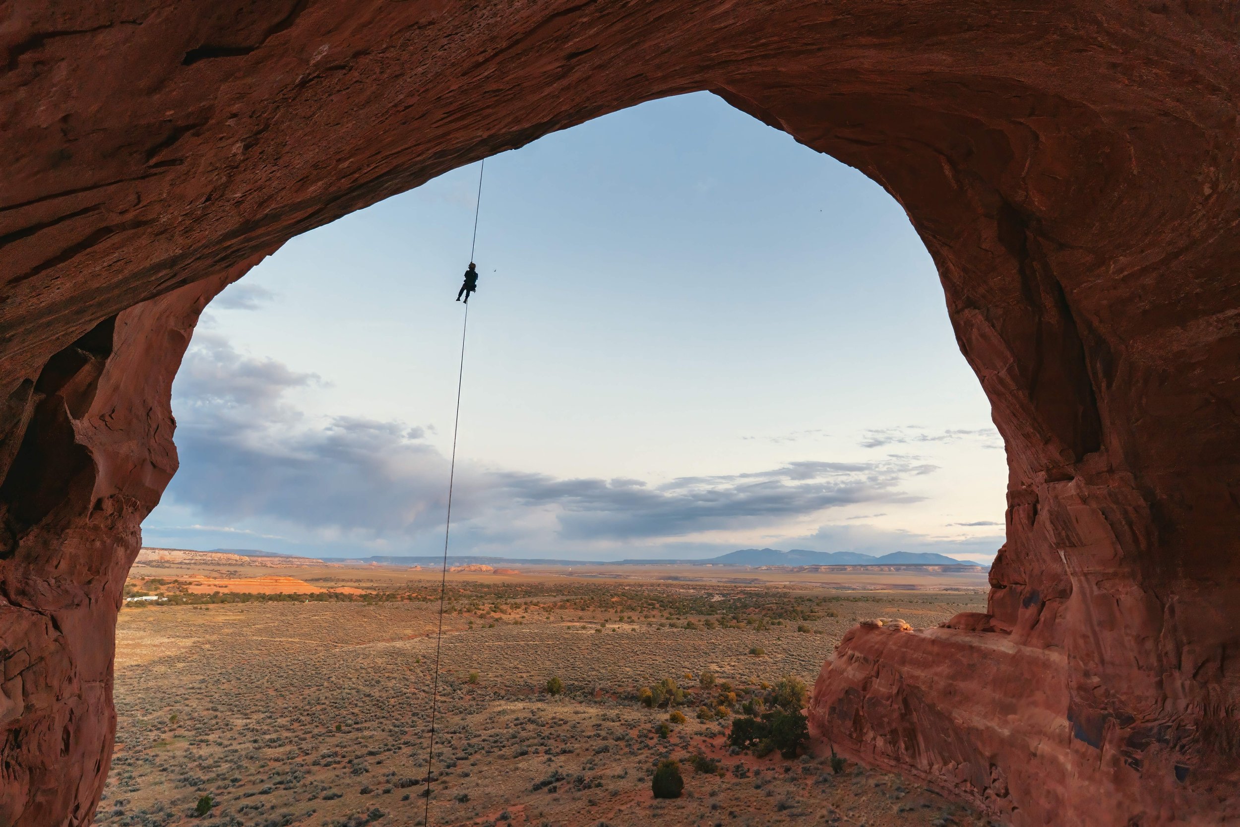 Suspended Between Two Worlds:
This photo captures the essence of a free-hanging rappel—the surreal moment suspended between two worlds. There’s a weightlessness that comes not just from gravity, but from the quiet, the stillness, and the sheer scale