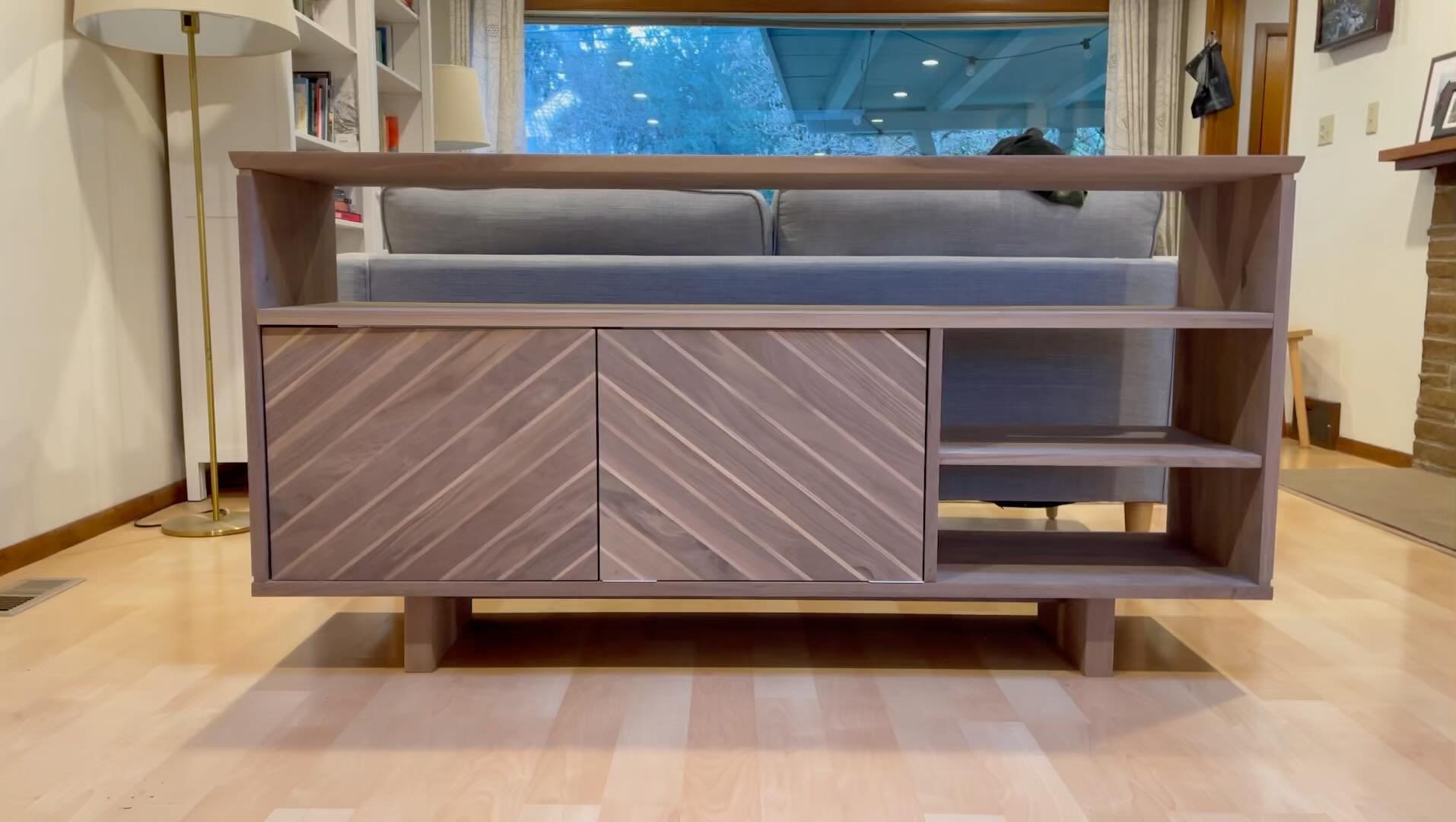 A custom designed credenza made from black walnut finished with two coats of hard wax oil. A custom piece made for my sister in law and her husband. Focusing on highly figured continuous grain, and finding unique places like the chevron doors to acce