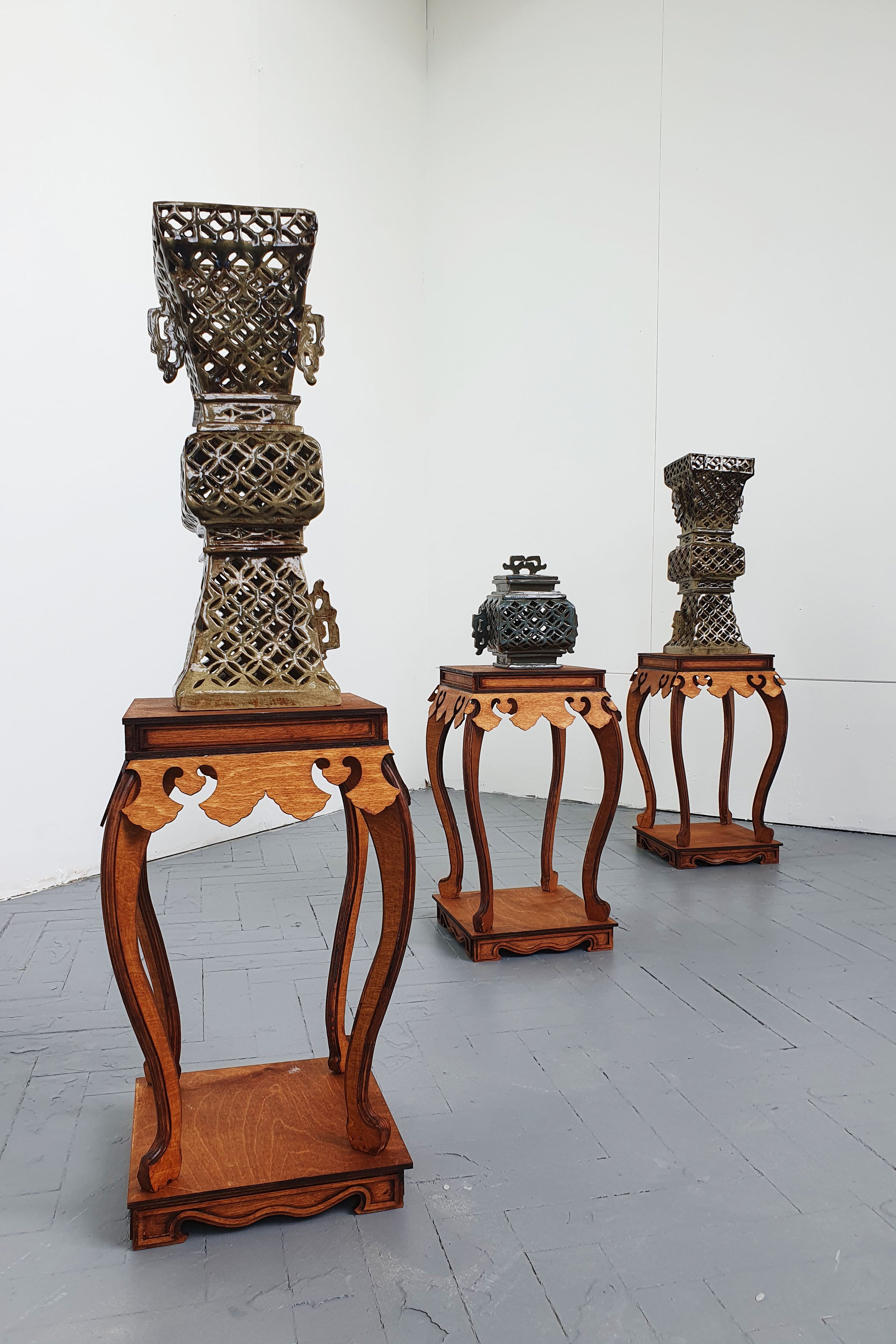 Between Places ( Prayer and Worship)
Glazed Stoneware, CNC Routed Birch Plywood and Laser Birch Plywood
145.8 x 30 x 30 cm (each)
Prayer and Worship features an array of openwork ceramic vessels. Arranged as a triptych within a triptych, the insta