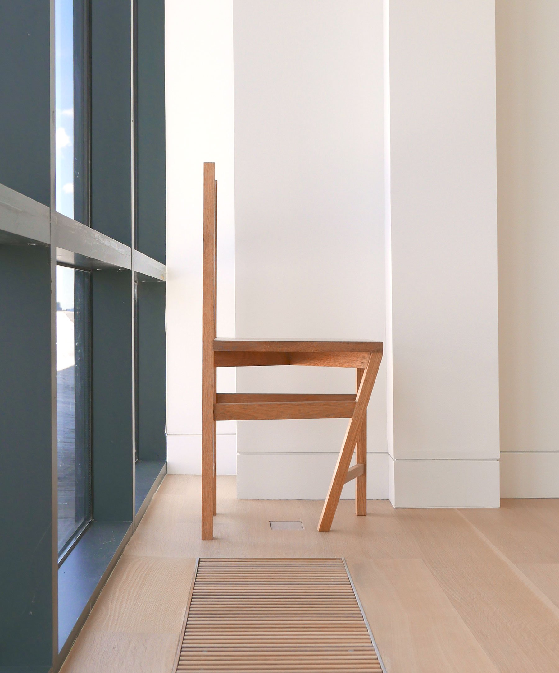The visible A of the 'Paradox of the Typical Atypical' chair from its side.