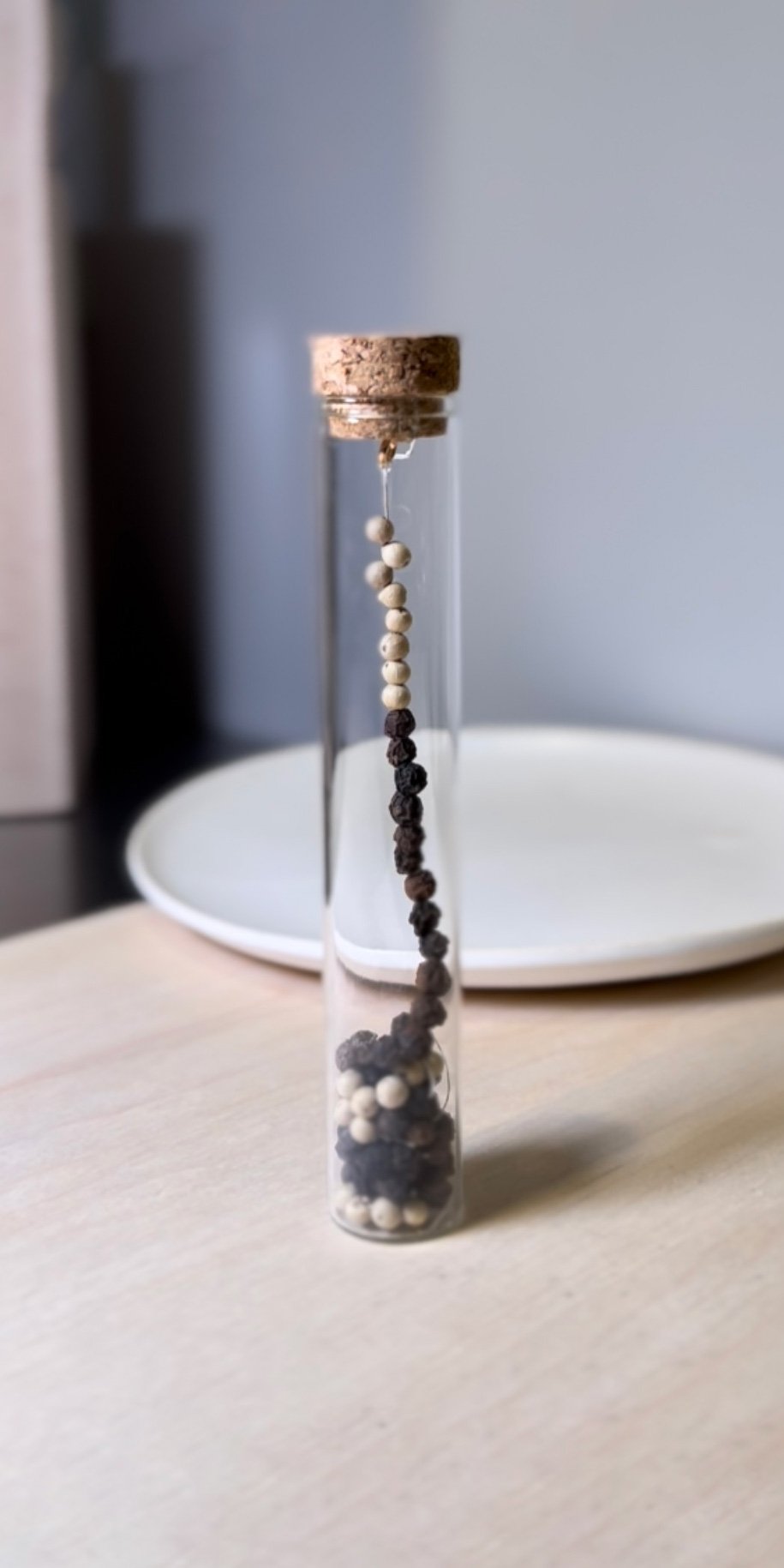 'Peppercorn Threads' symbolize cosmic equilibrium and interconnectedness.