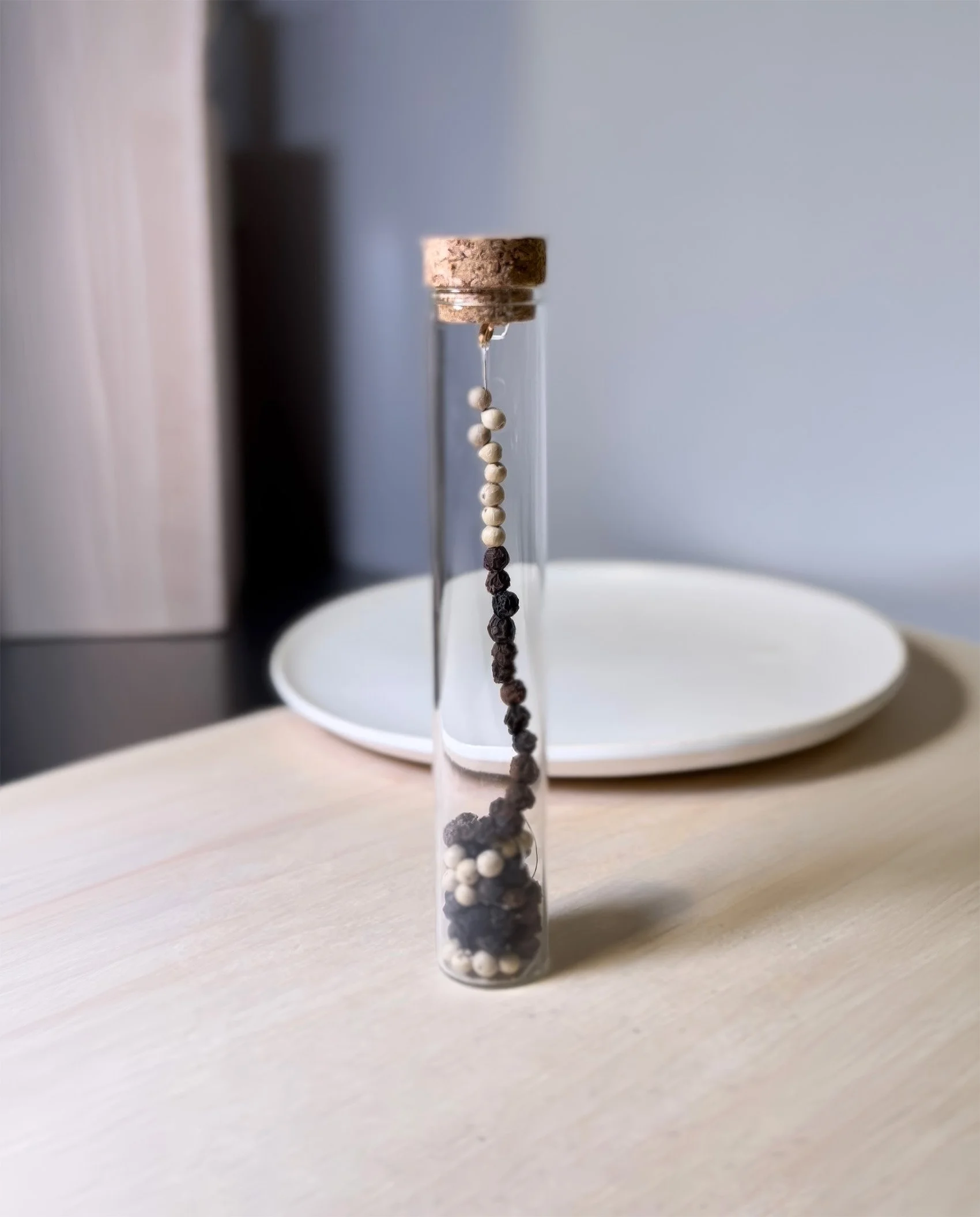 Flavors of Misconduct: Ordinary spices reshaped into small self-questioning devices: chili clusters, cinnamon teardrops, pepper threads, rosemary stacks, ginger bullets, and paprika impact buttons.