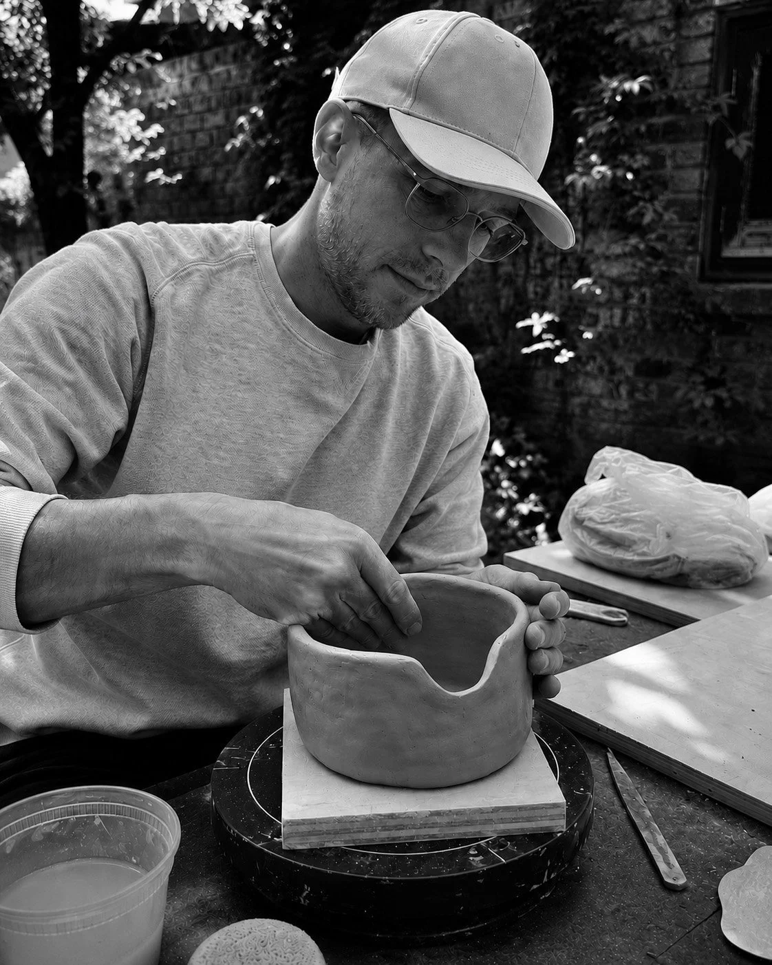 Martin Lenclos working in Red Hook Brooklyn on the Jacob Vase by coiling the clay.