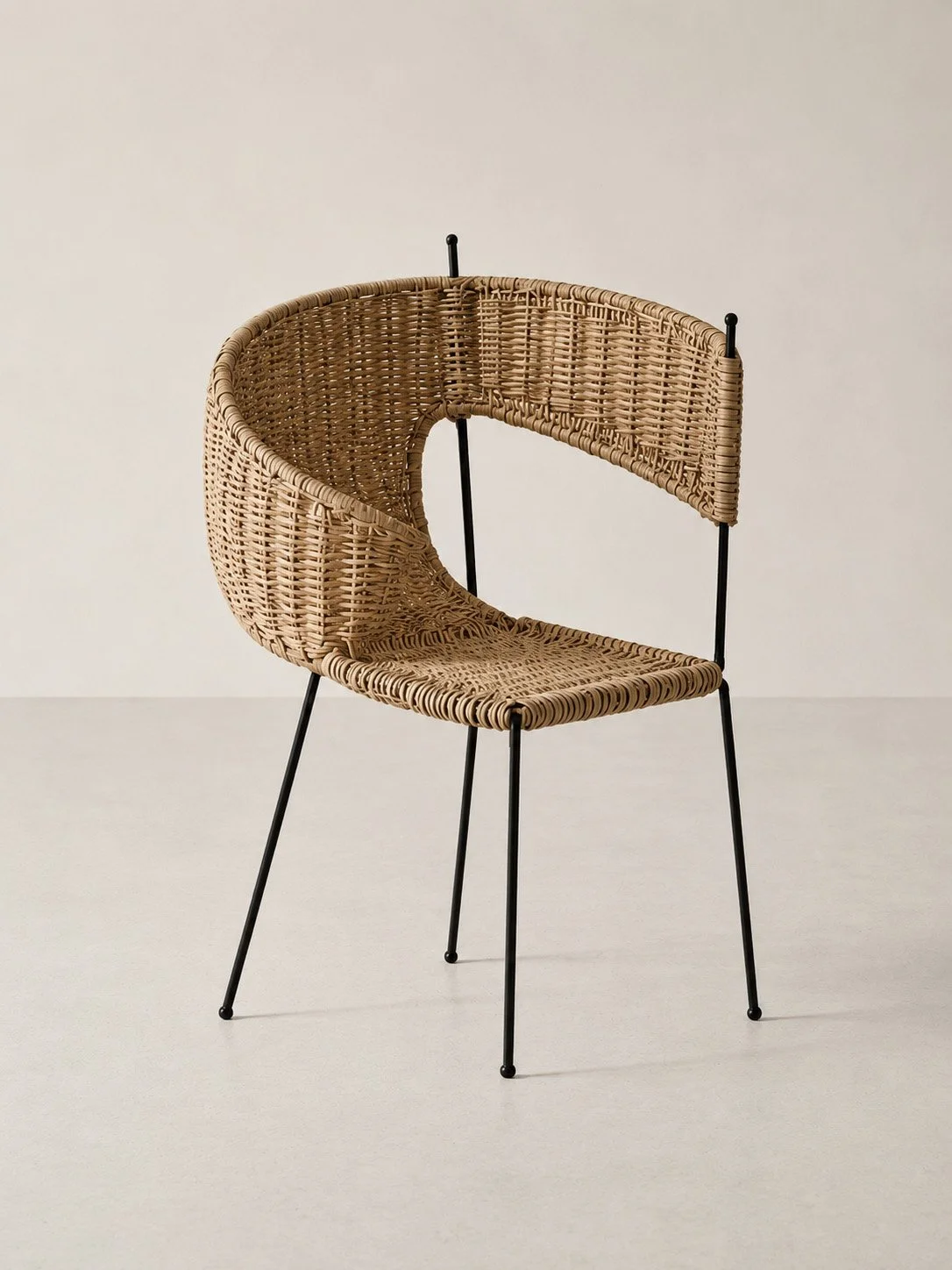 The Bruised Weave — Chair; Ordinary witness study — woven rattan / blackened steel