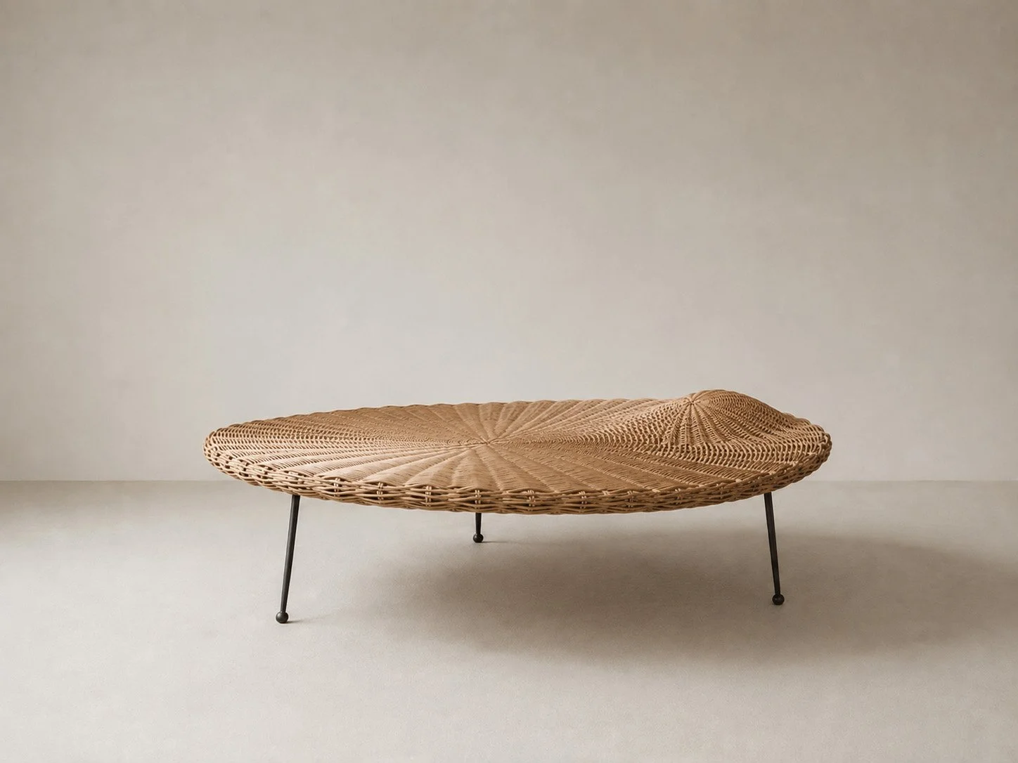 The Bruised Weave — Low Table; Ordinary witness study — woven rattan / blackened steel