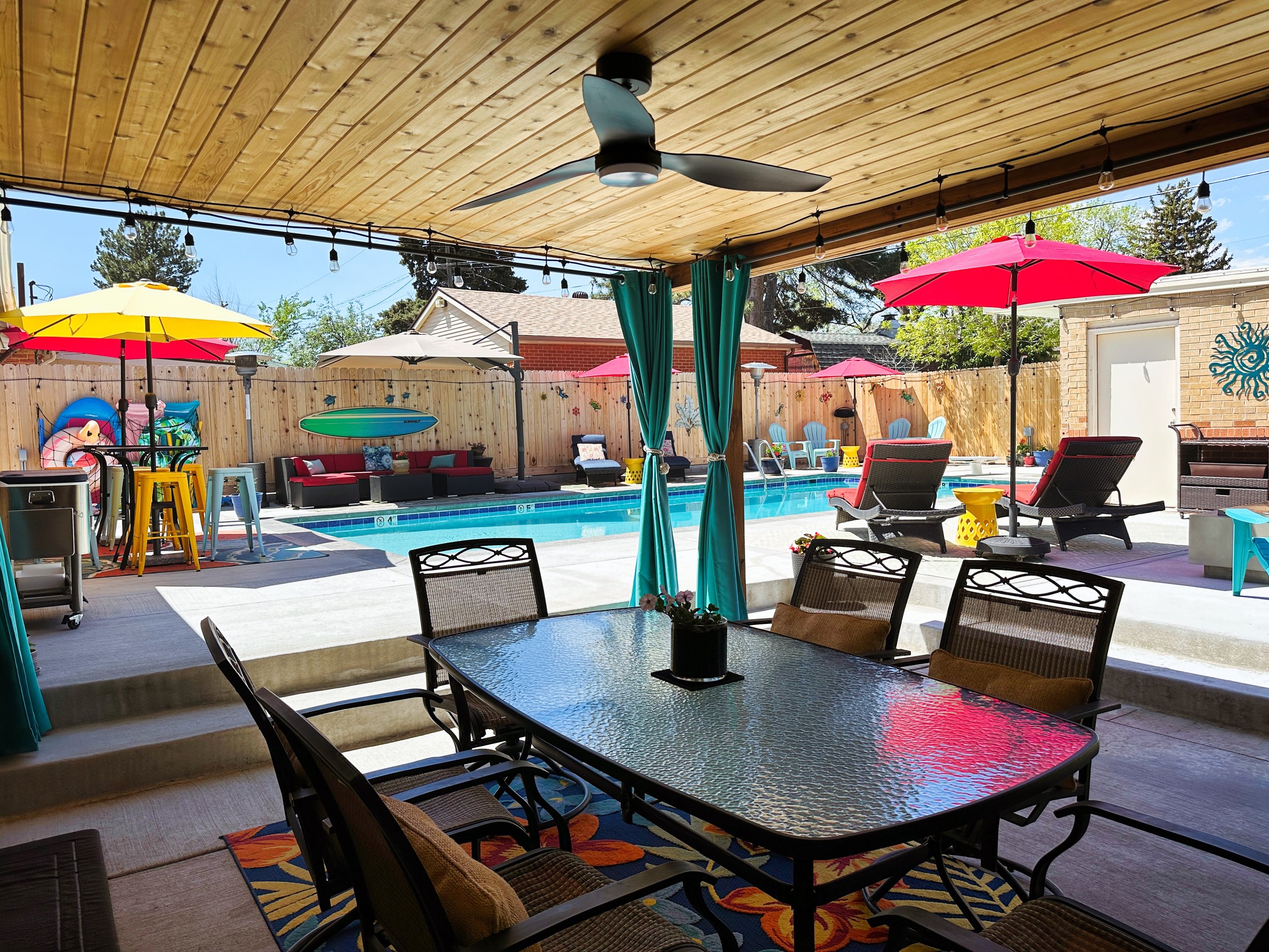 The patio table is under the covered patio for eating or just chatting around when you need a little reprieve from the sun. And the ceiling fan feels amazing.