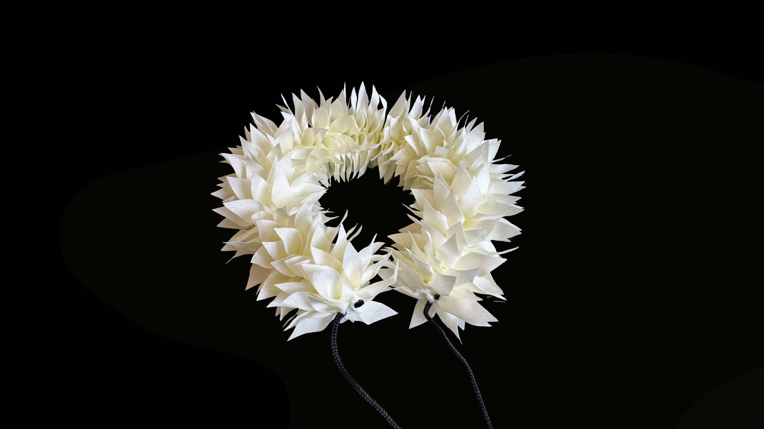 White flower strand used for hair decoration in Indian Classical Dance.