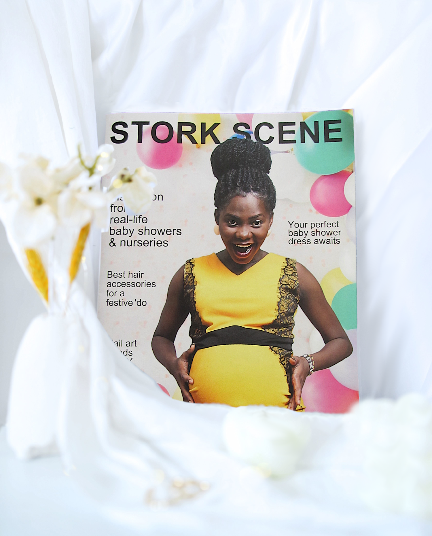 Stork Scene Magazine Sample Cover With Happy Pregnant Mom and Colorful Balloons in the Background.