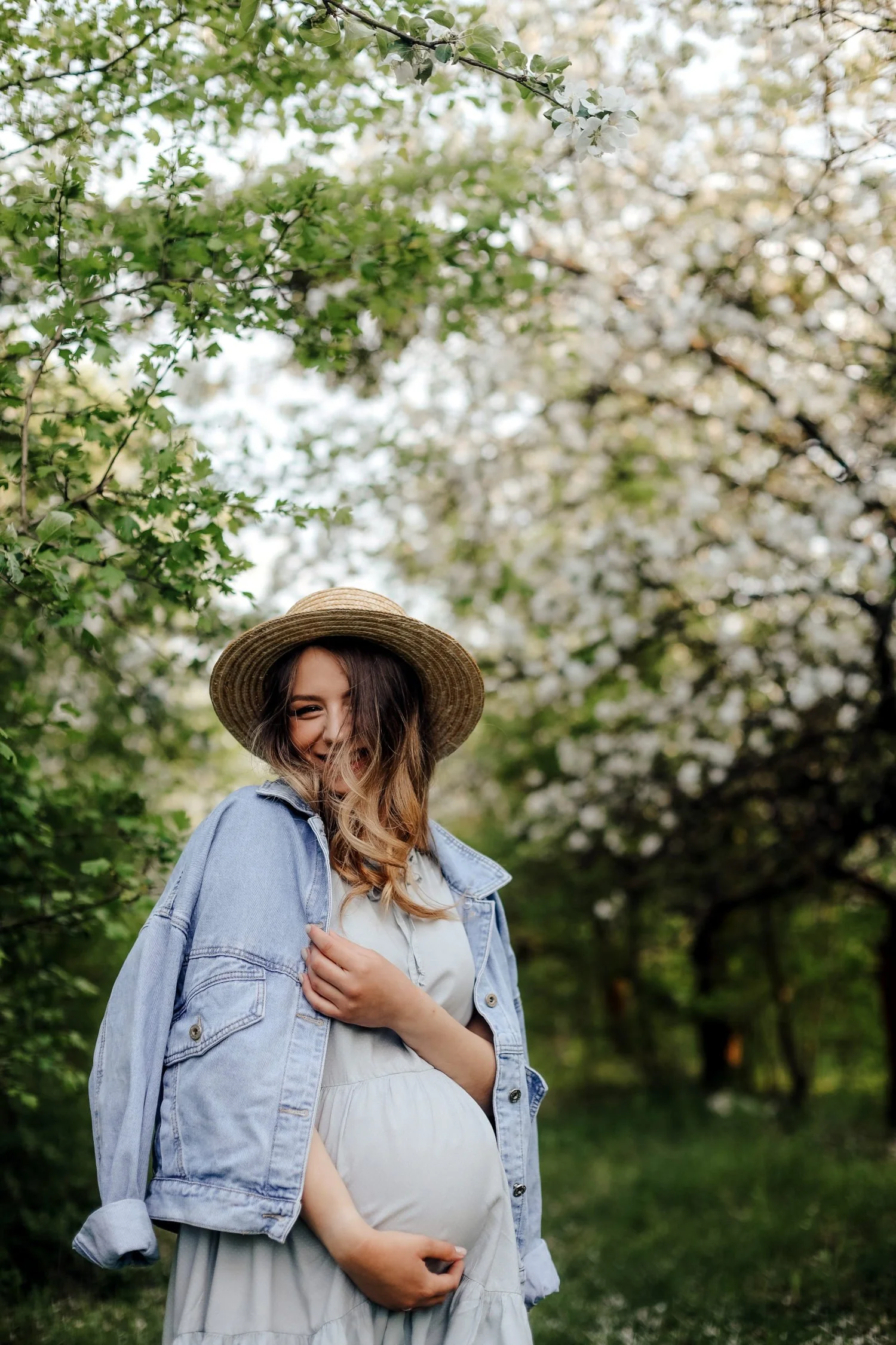 Pregnant Mom Wearing Maternity Dress and Denim Jacket