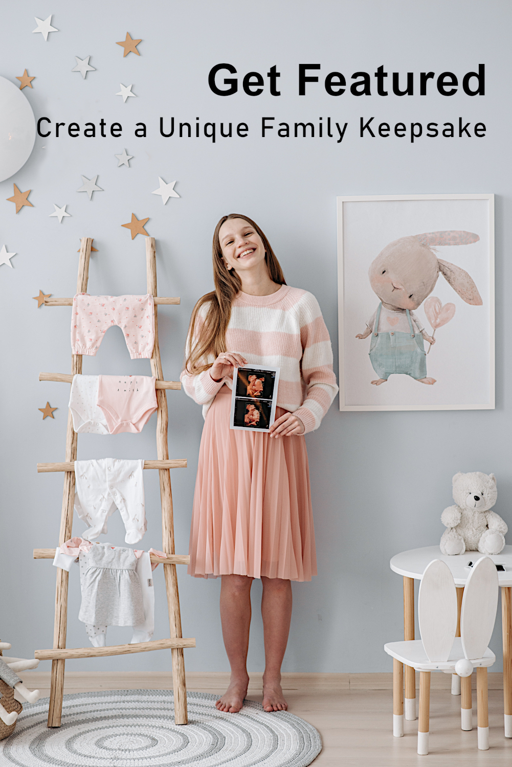 Smiling Pregnant Mom Standing in Baby Nursery With Decorations Holding Sonogram Pictures.