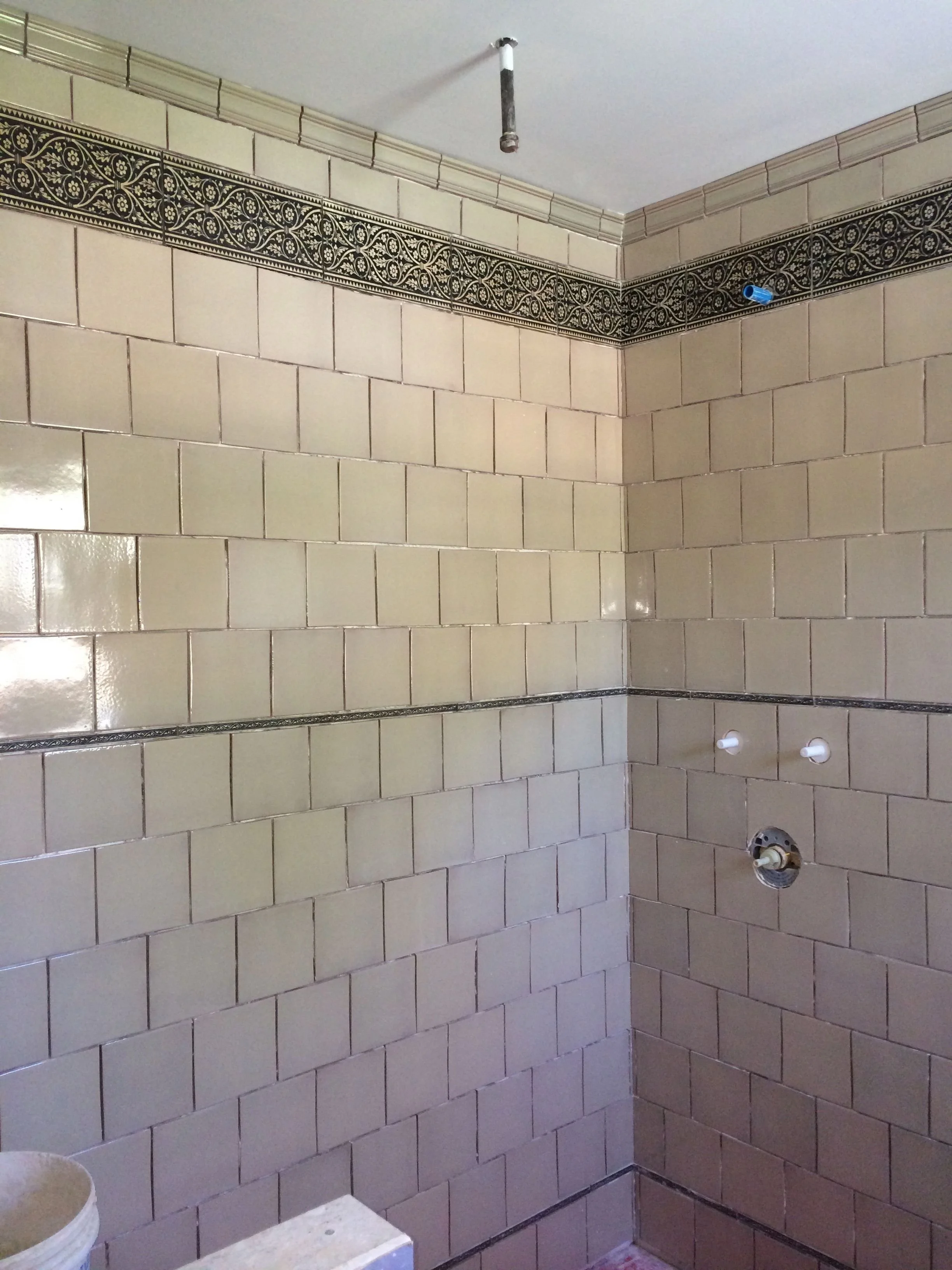 Decorative travertine stone borders for a shower ( Monmouth Street tile )