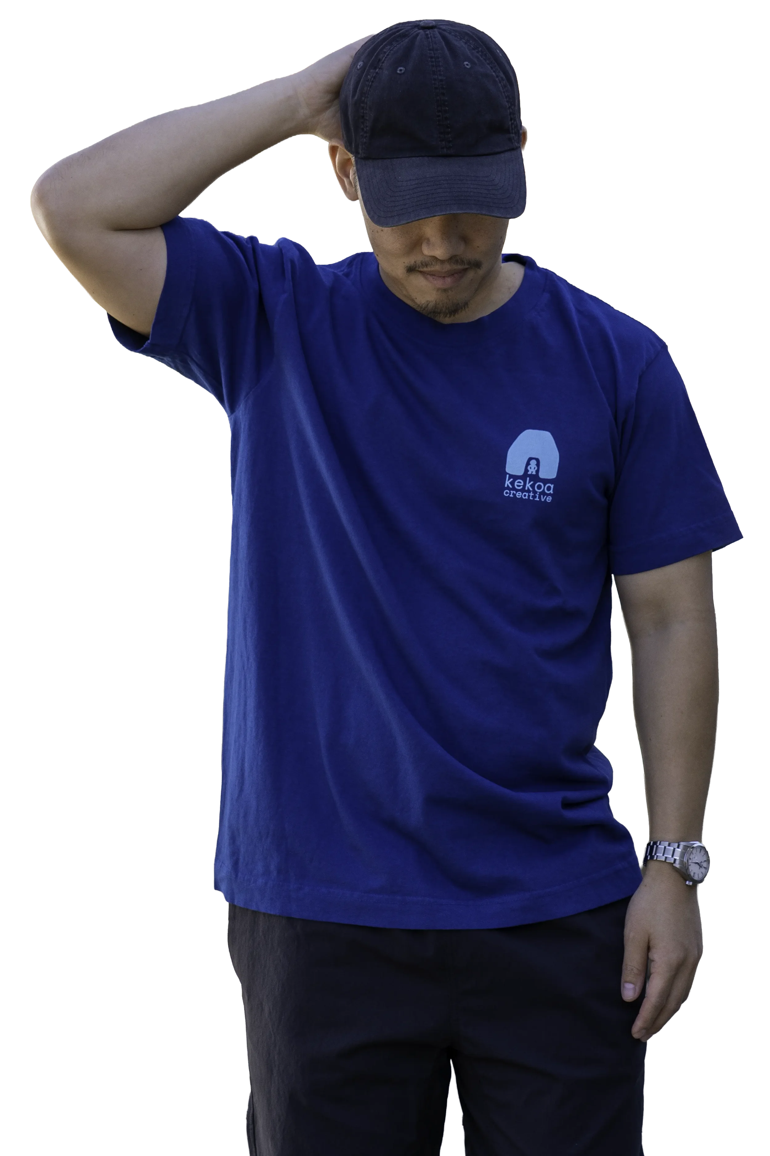 Model wearing unisex Moana Blue Kumulipo i ke Kohola short sleeve reclaimed cotton graphic tee with chest logo by Kekoa Creative.