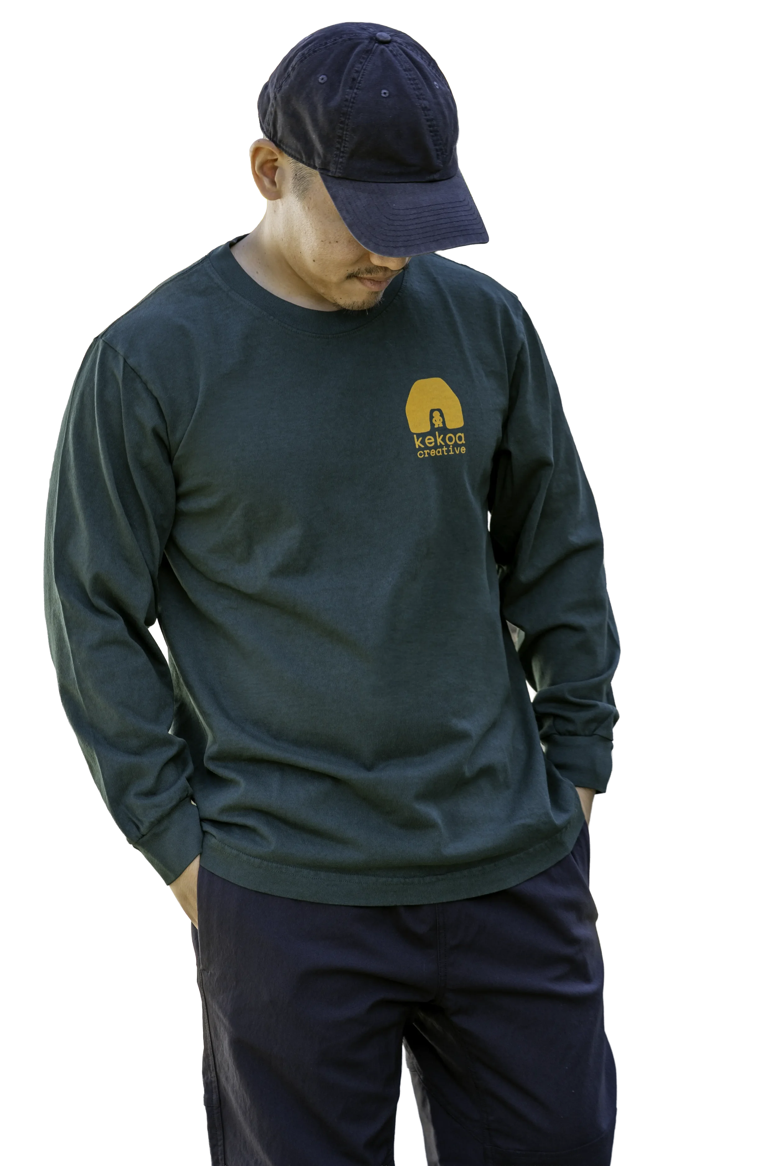 Model wearing unisex Nahele Green Kauila long sleeve reclaimed cotton trash tee with yellow chest logo by Kekoa Creative.