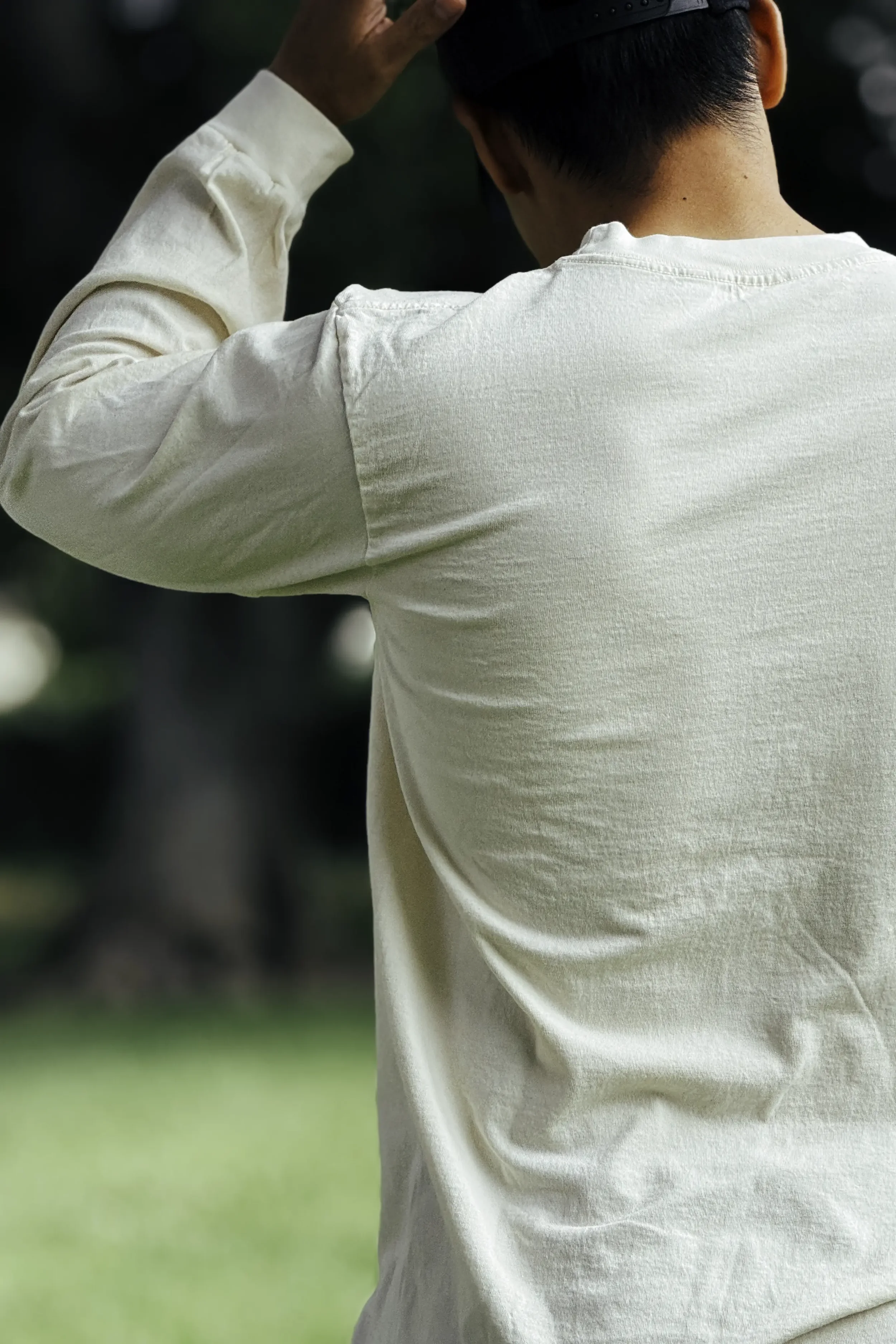 Back view of minimal unprinted undyed natural cotton long sleeve trash tee by Kekoa Creative.