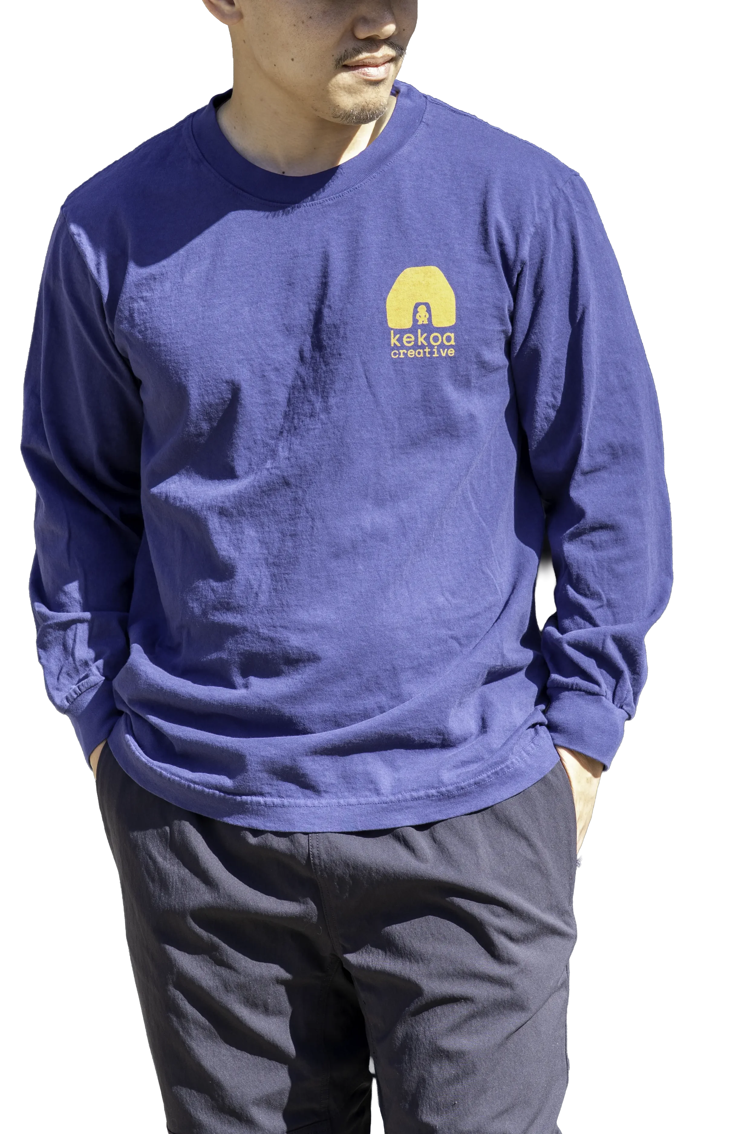 Model wearing unisex Dark Navy Blue Kauila long sleeve reclaimed cotton trash tee with yellow chest logo by Kekoa Creative.