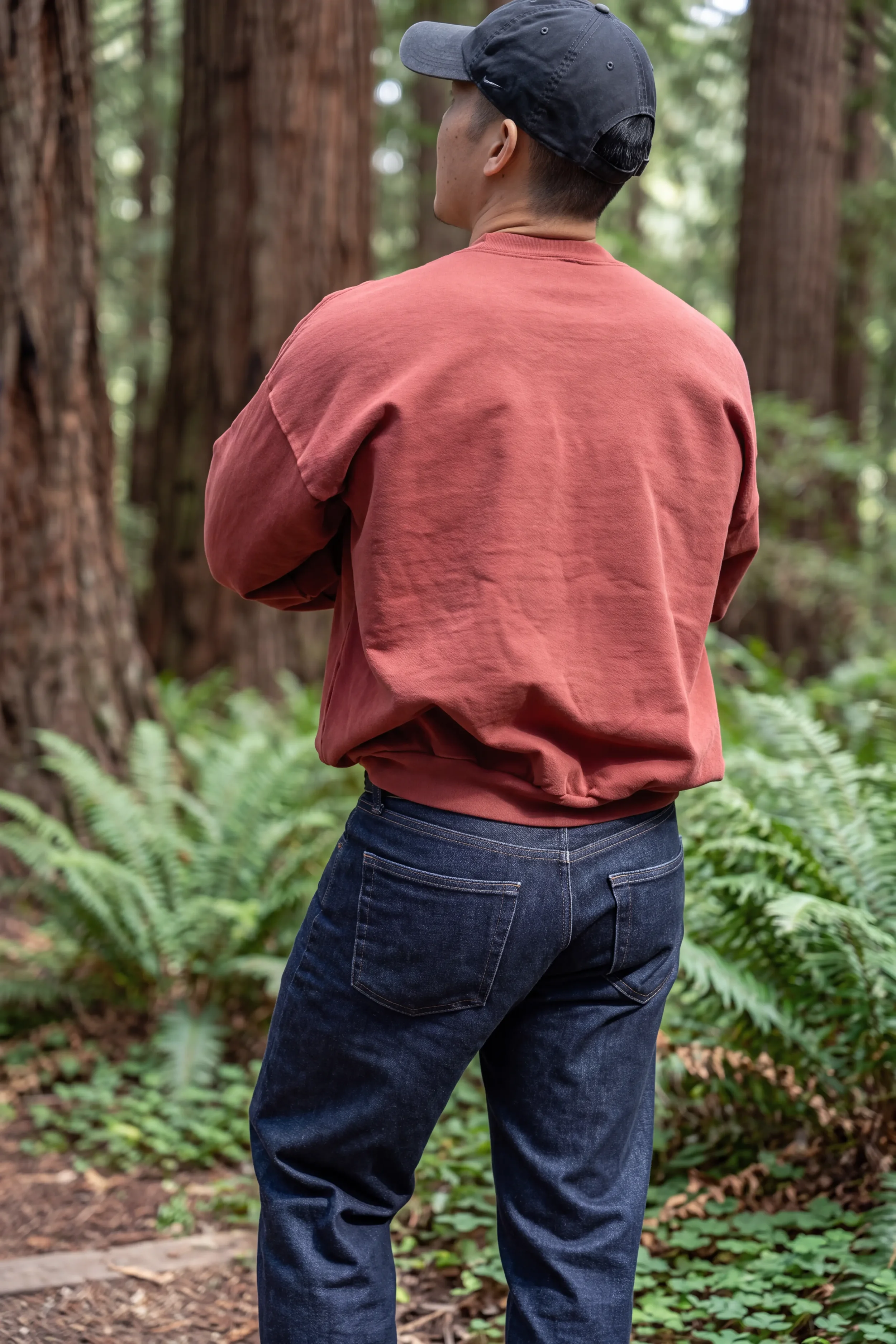 Back view of unprinted ʻŌhelo Red drop-shoulder boxy trash crewneck sweatshirt sitting at the hip by Kekoa Creative.