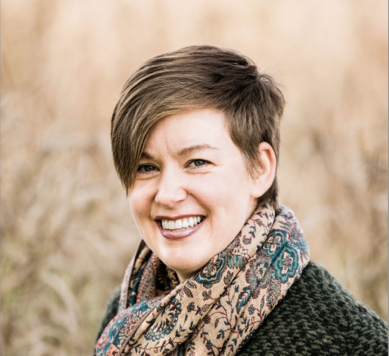 A smiling massage therapist