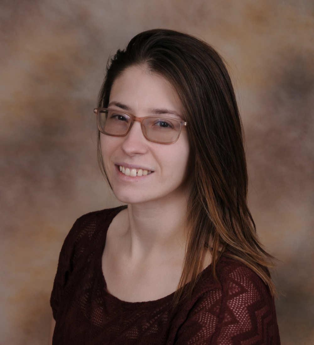A smiling massage therapist