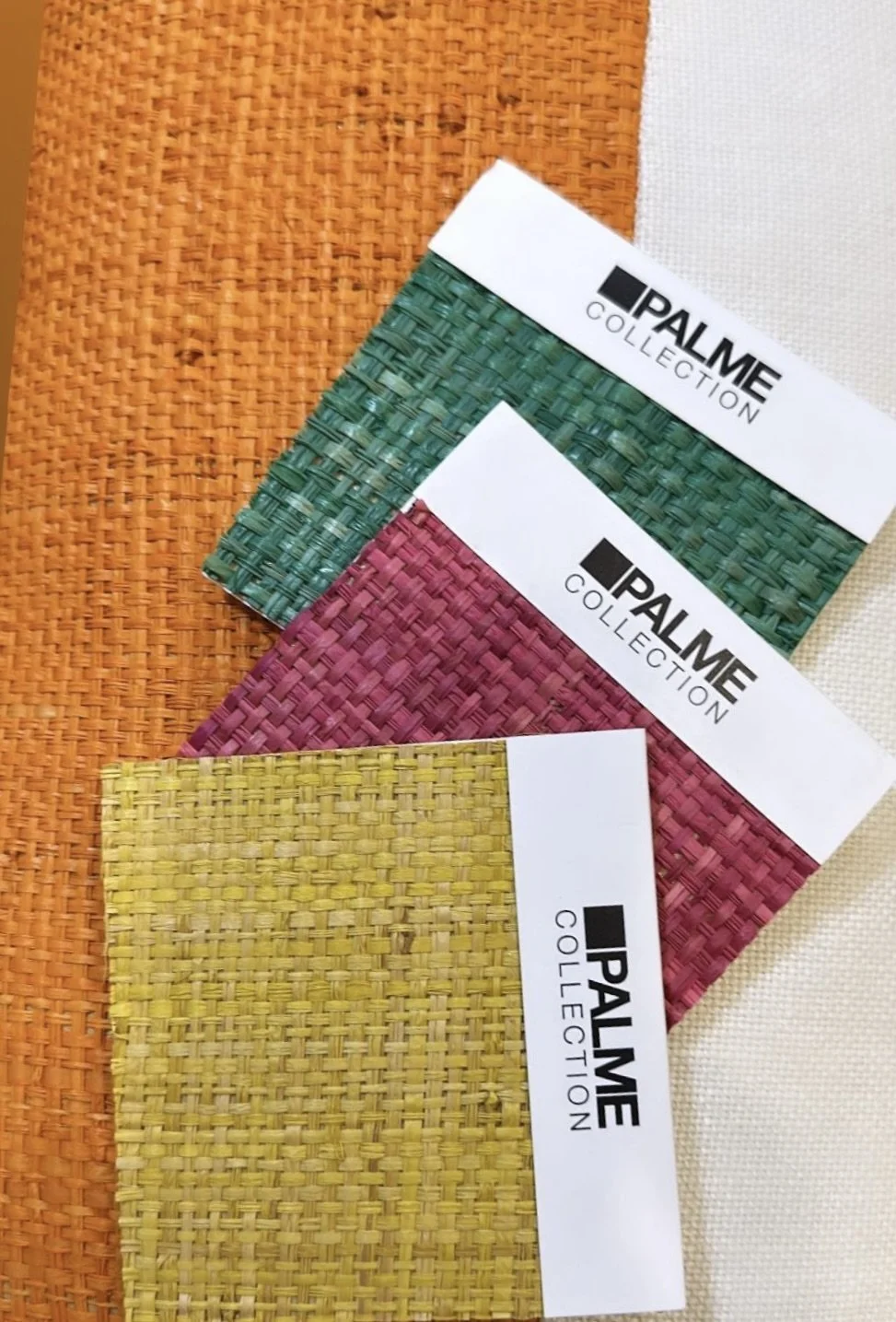 Color swatches from Palme Collection in green, pink, and yellow, placed on textured orange, white, and beige backgrounds.