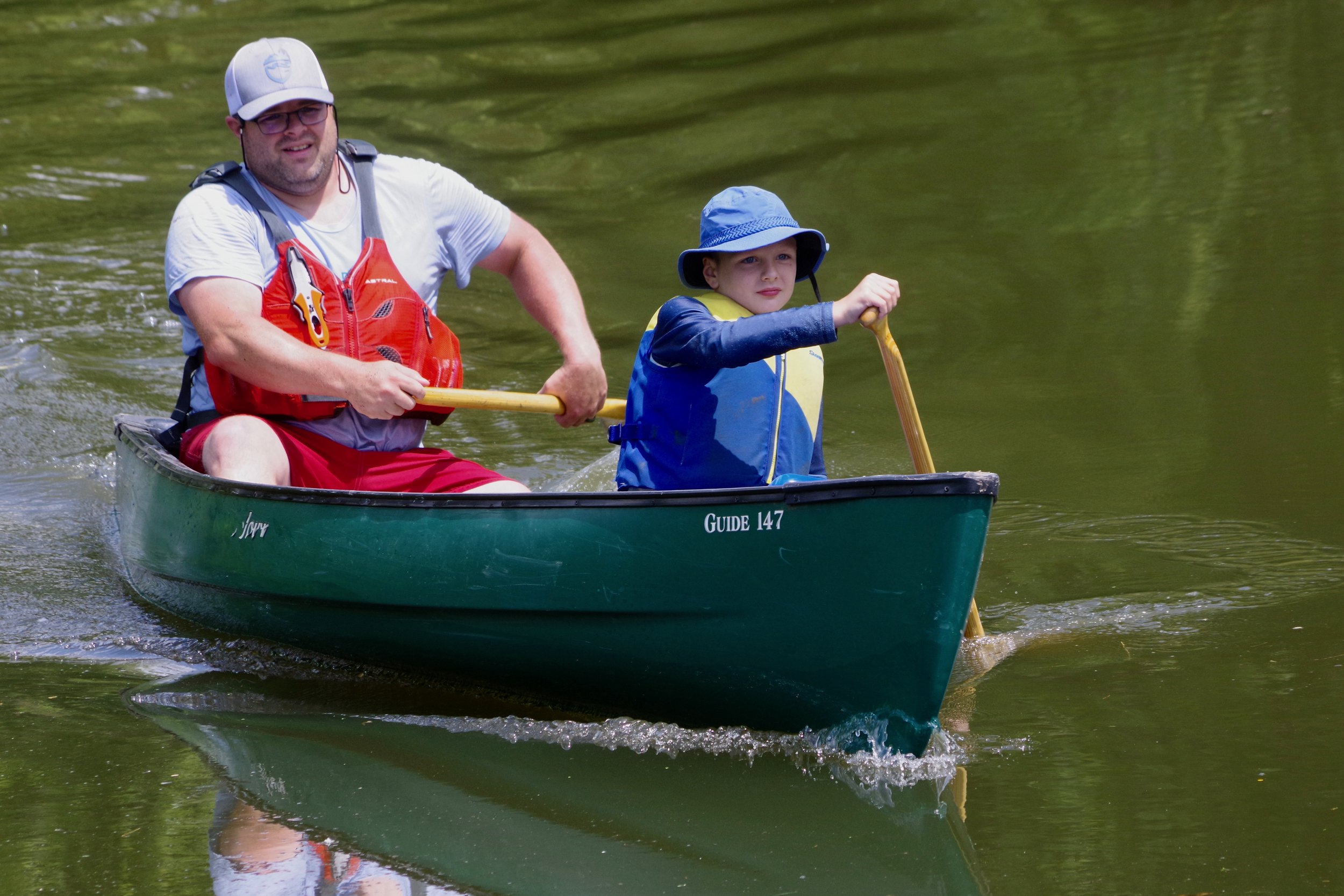 Chris and Judah Wilson paddle toward the Lazy Beaver finish line. 