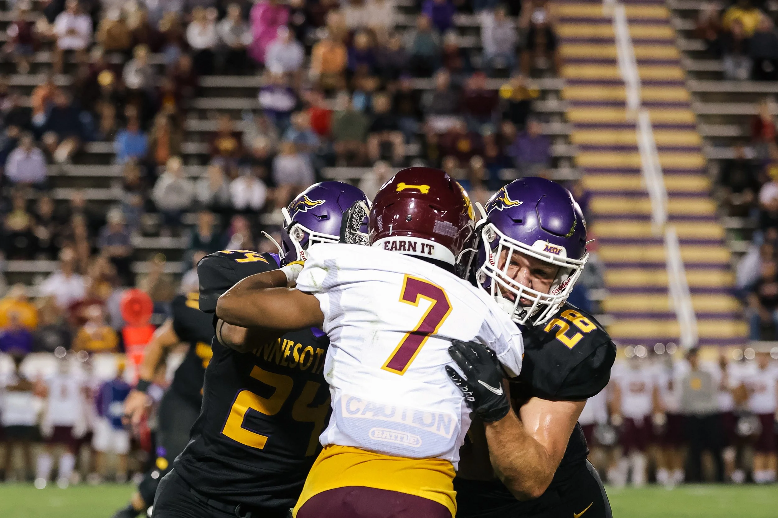 Football Players Tackling.jpg