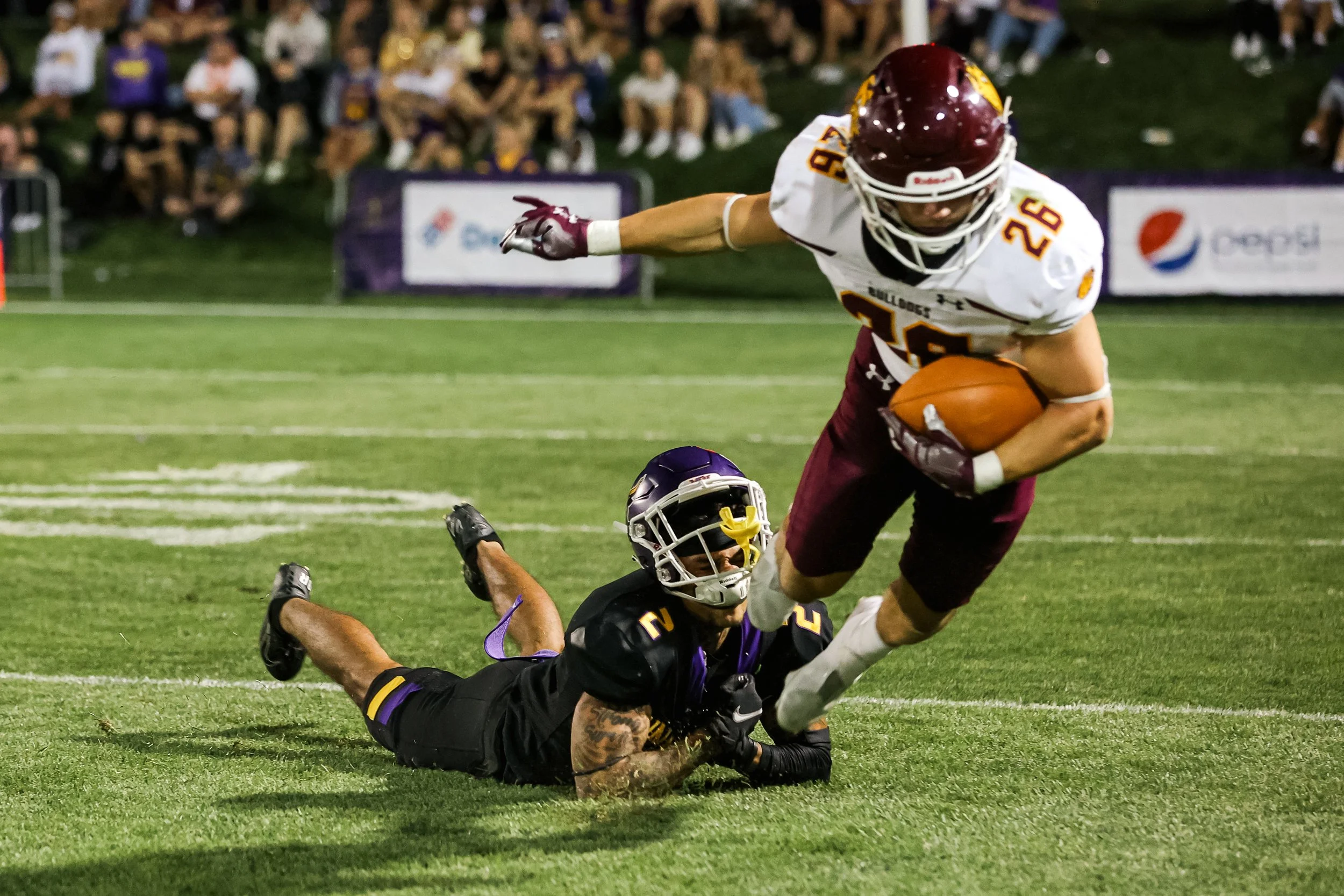 Take down by football player.jpg