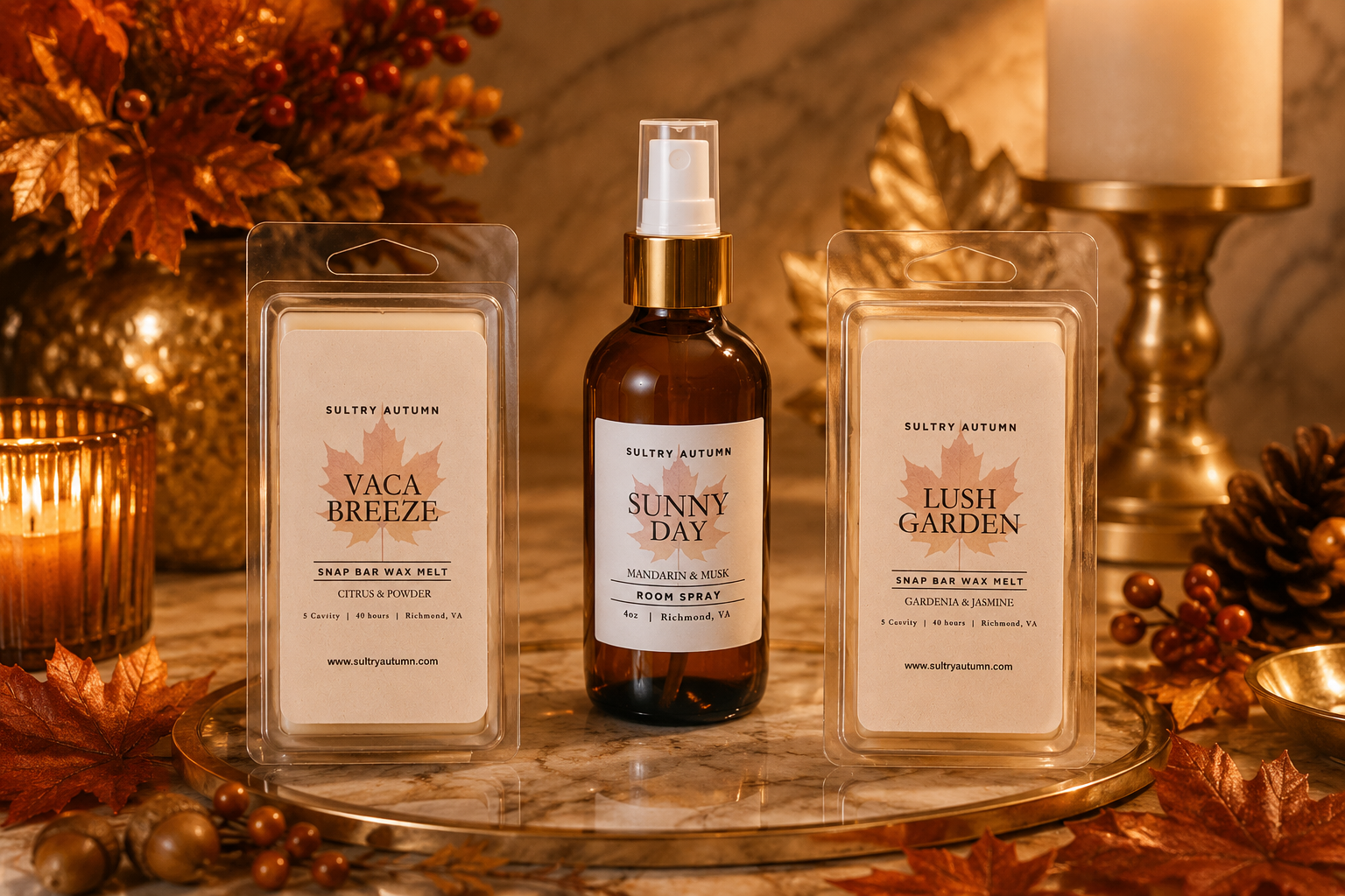 Autumn-themed display of room spray and wax melts with fall leaves, candles, and decorative objects.