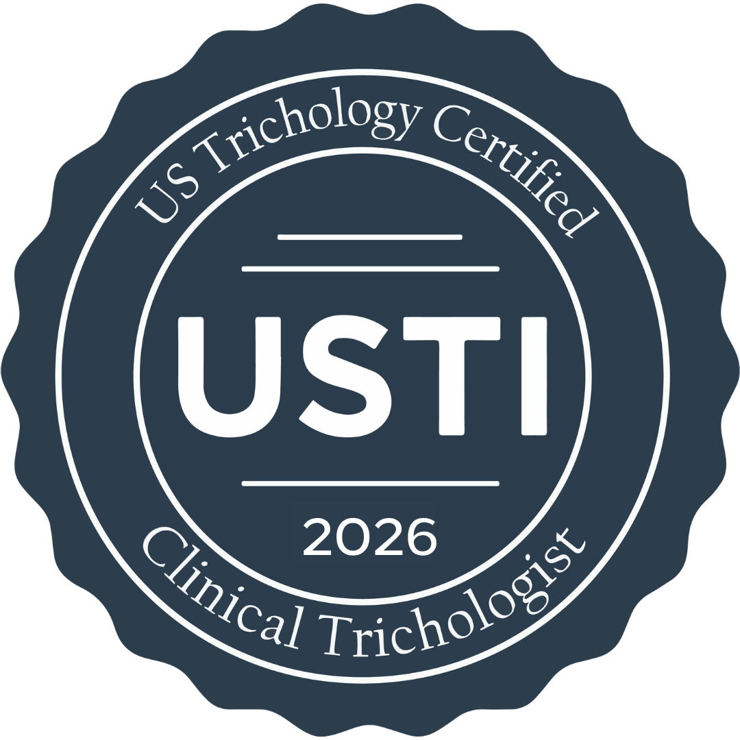 A circular badge with a scalloped edge, reading 'US Trichology Certified 2026' and 'Clinical Trichologist,' with 'USTI' in the center.