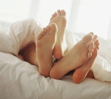 Feet in bed