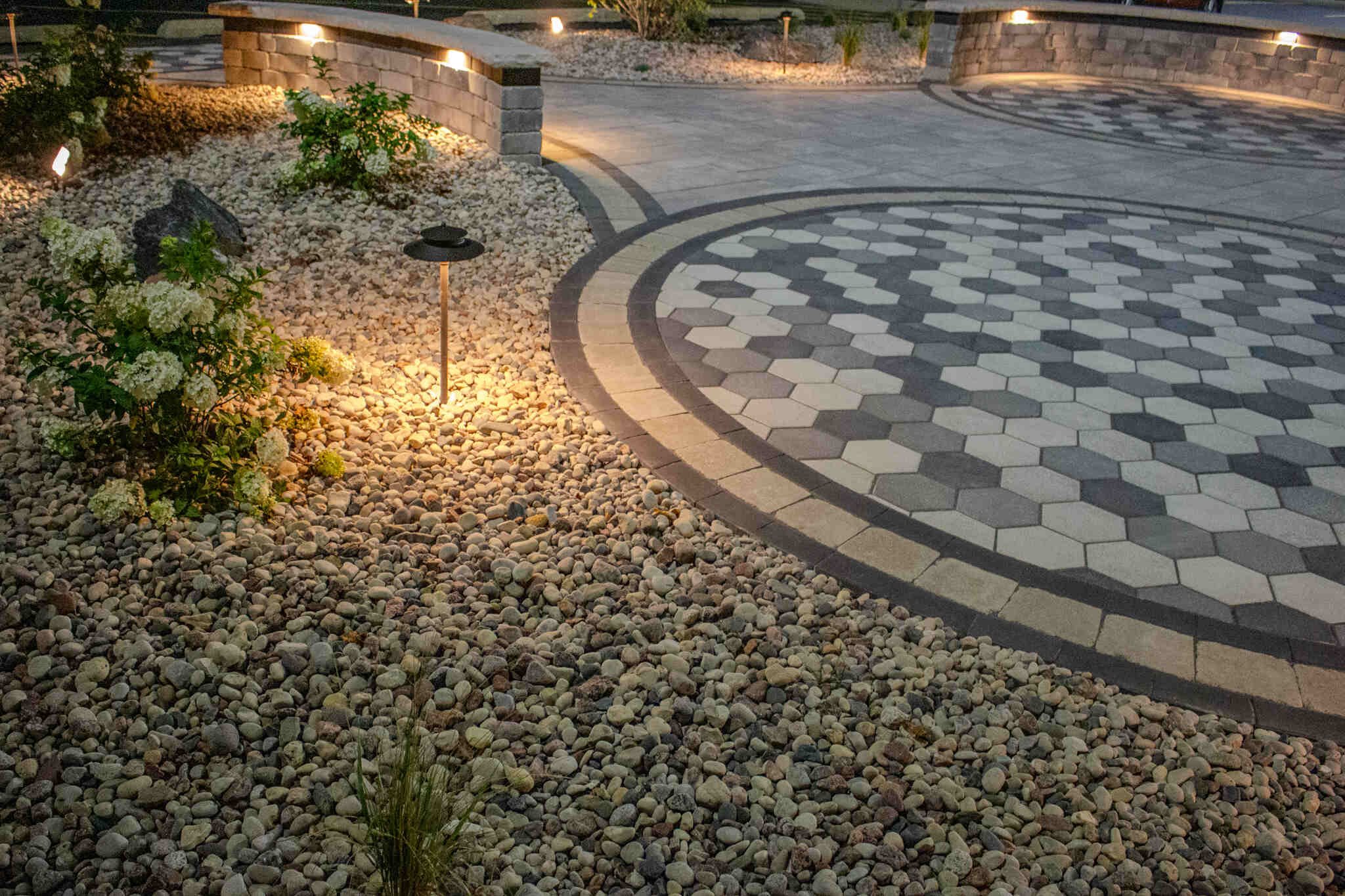 Outdoor lighting along paver patio and walkway
