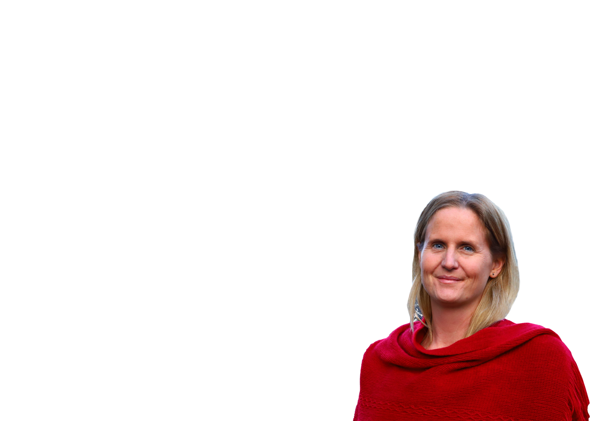 A woman with blonde hair wearing a red shawl smiling at the camera.