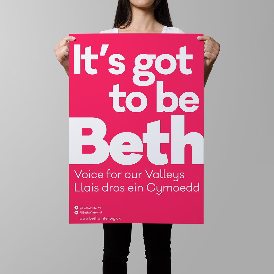 Person holding a pink sign that reads 'It's got to be Beth. Voice for our Valleys. Llais dros ein Cymoedd.'