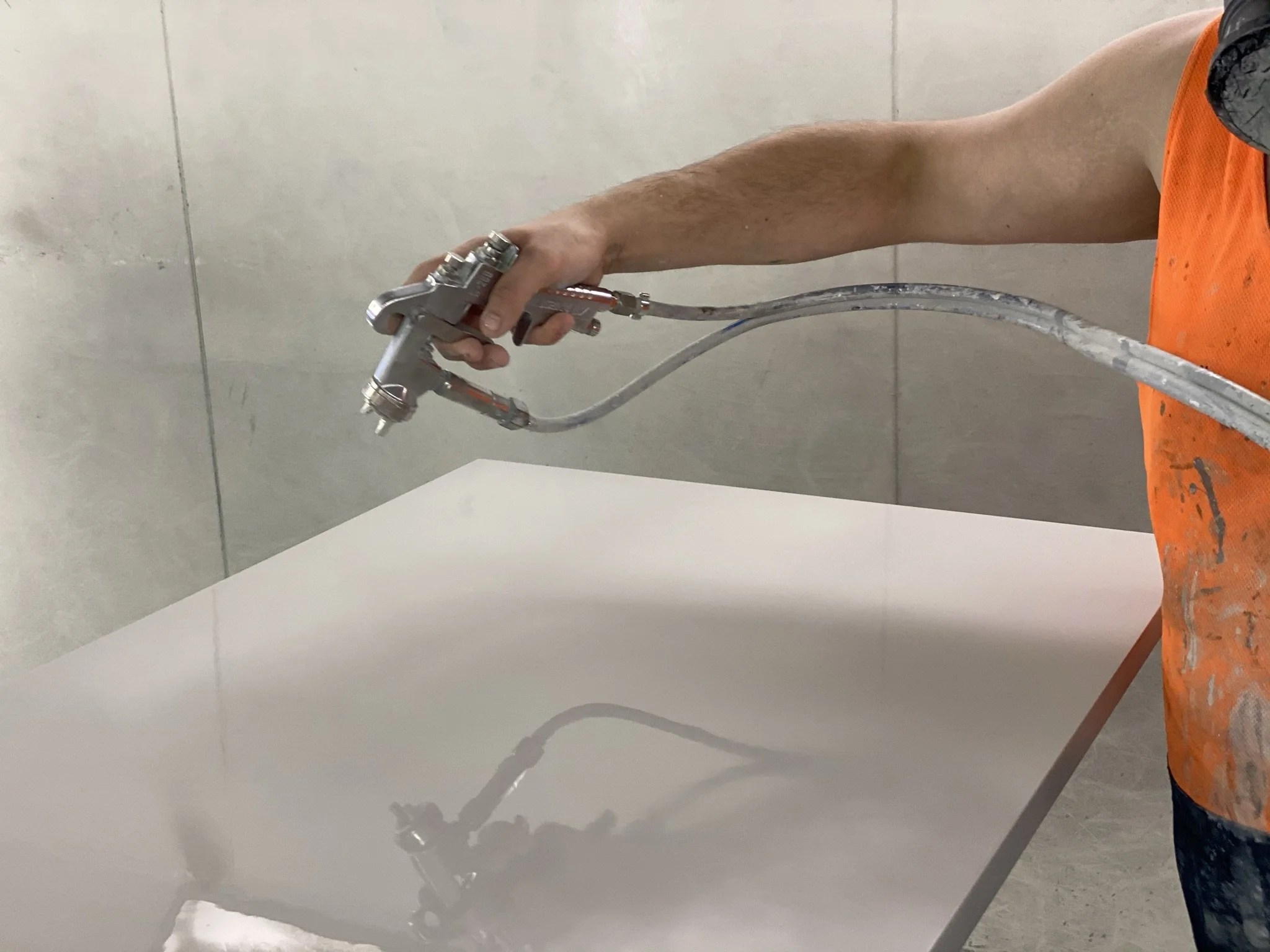 2PAC door being spray painted for a smooth, high-end finish