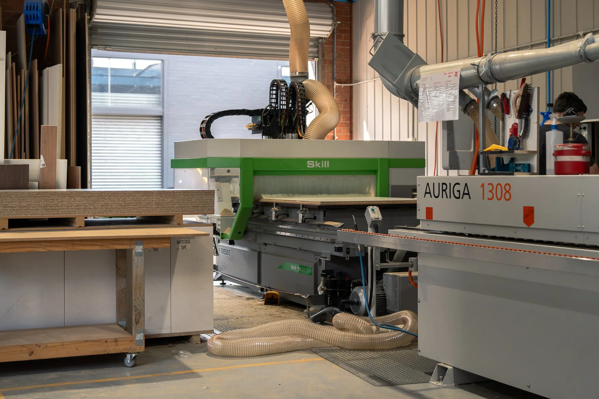 Precision CNC router implementing precision square cuts with exact dimensions, no chipping or tearout