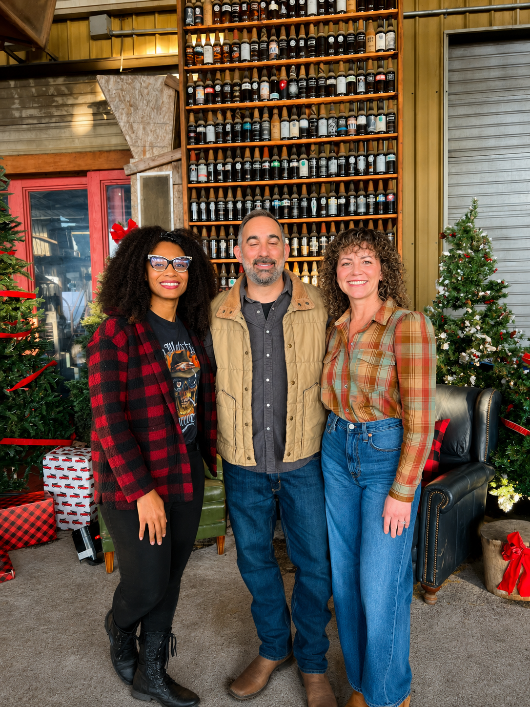 Guests enjoy a relaxed holiday celebration surrounded by custom seasonal décor, Christmas trees, and a festive lounge-style setting.