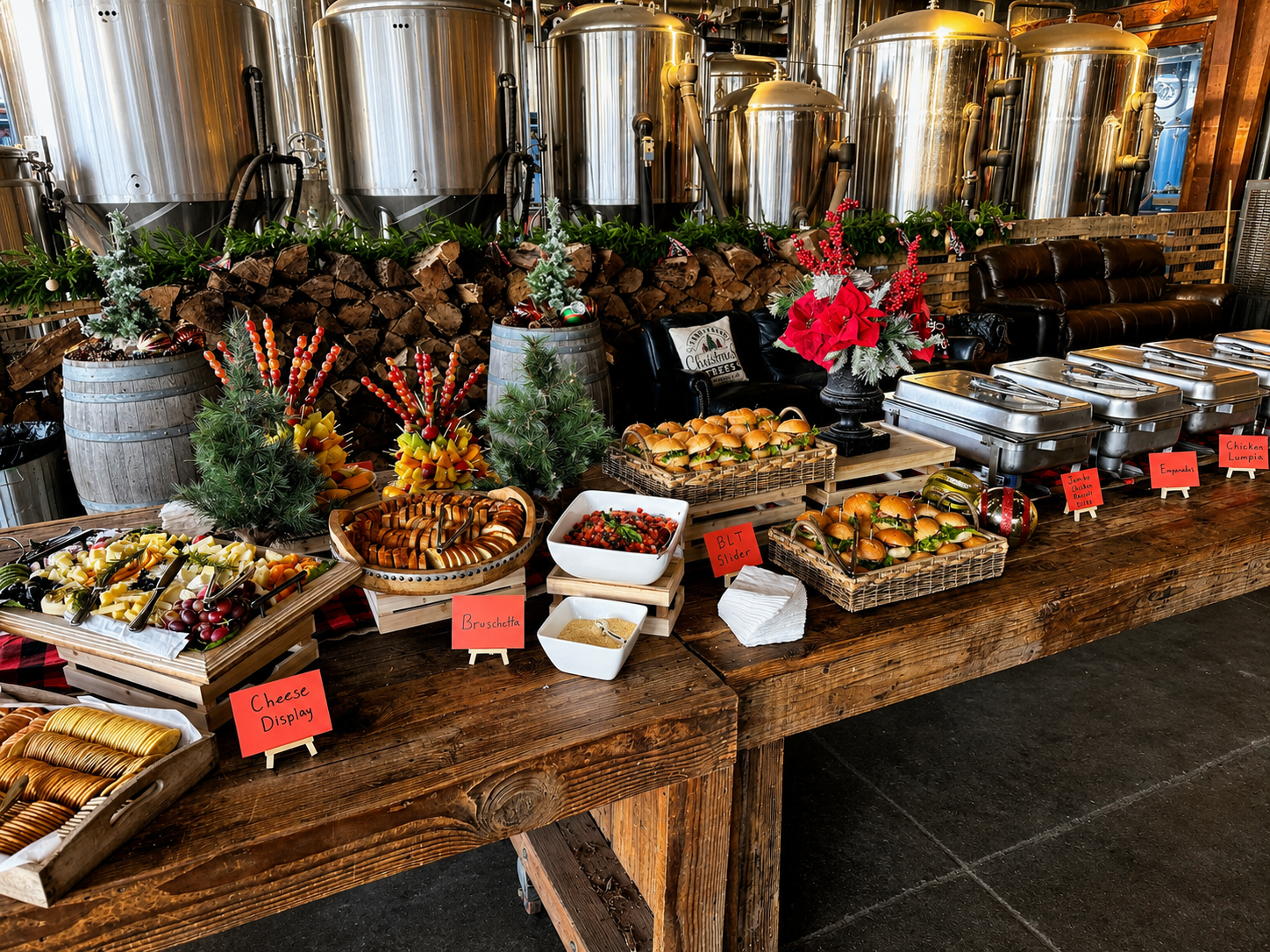 A rustic holiday buffet featuring artisan appetizers, sliders, charcuterie, seasonal greenery, festive floral accents, and warm food service stations.