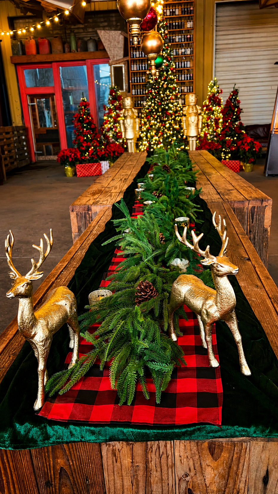 Christmas table design featuring gold reindeer, fresh greenery, buffalo plaid and a glowing tree display.