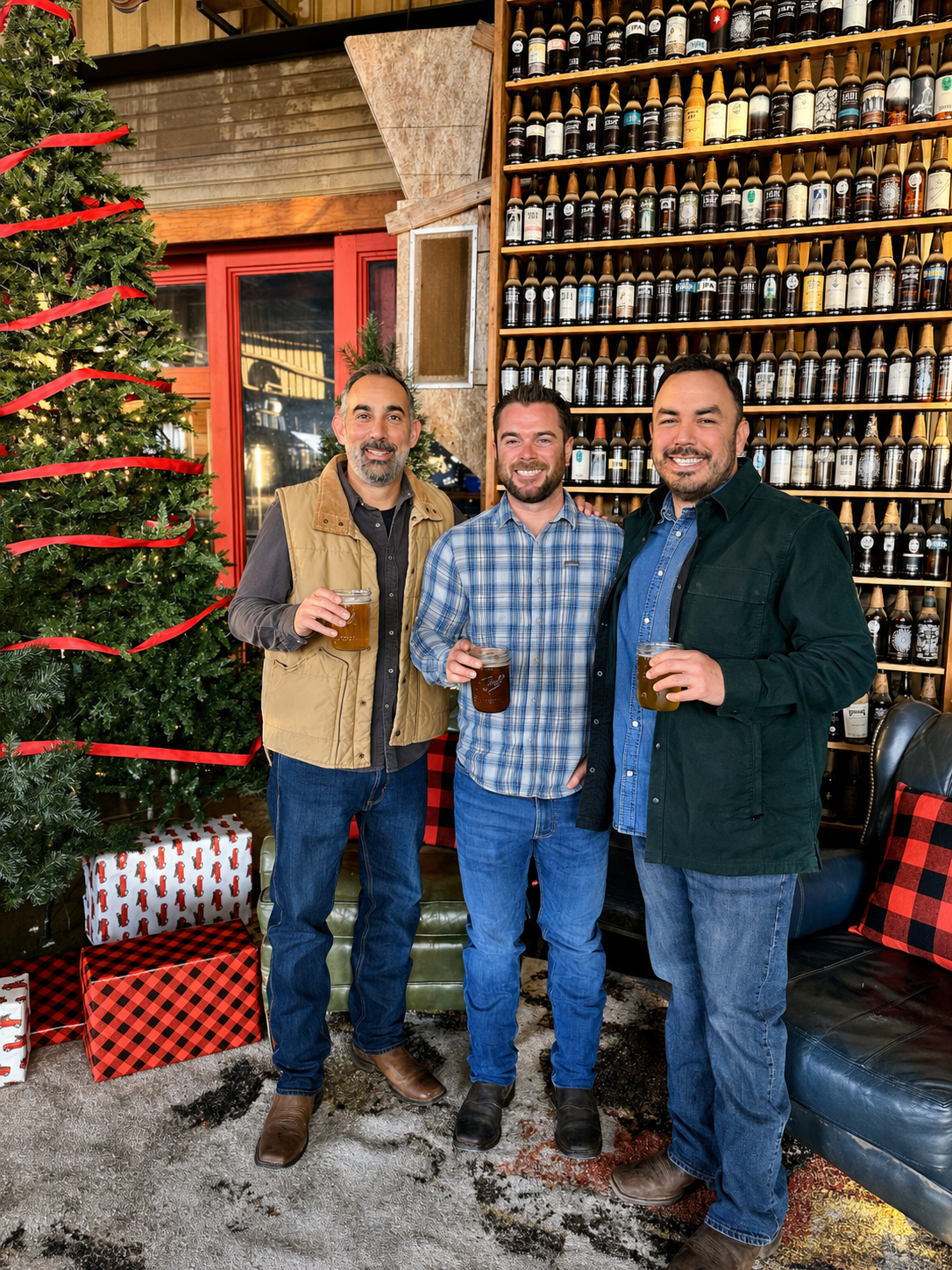 Guests enjoy a relaxed holiday celebration surrounded by custom seasonal décor, Christmas trees, and a festive lounge-style setting.