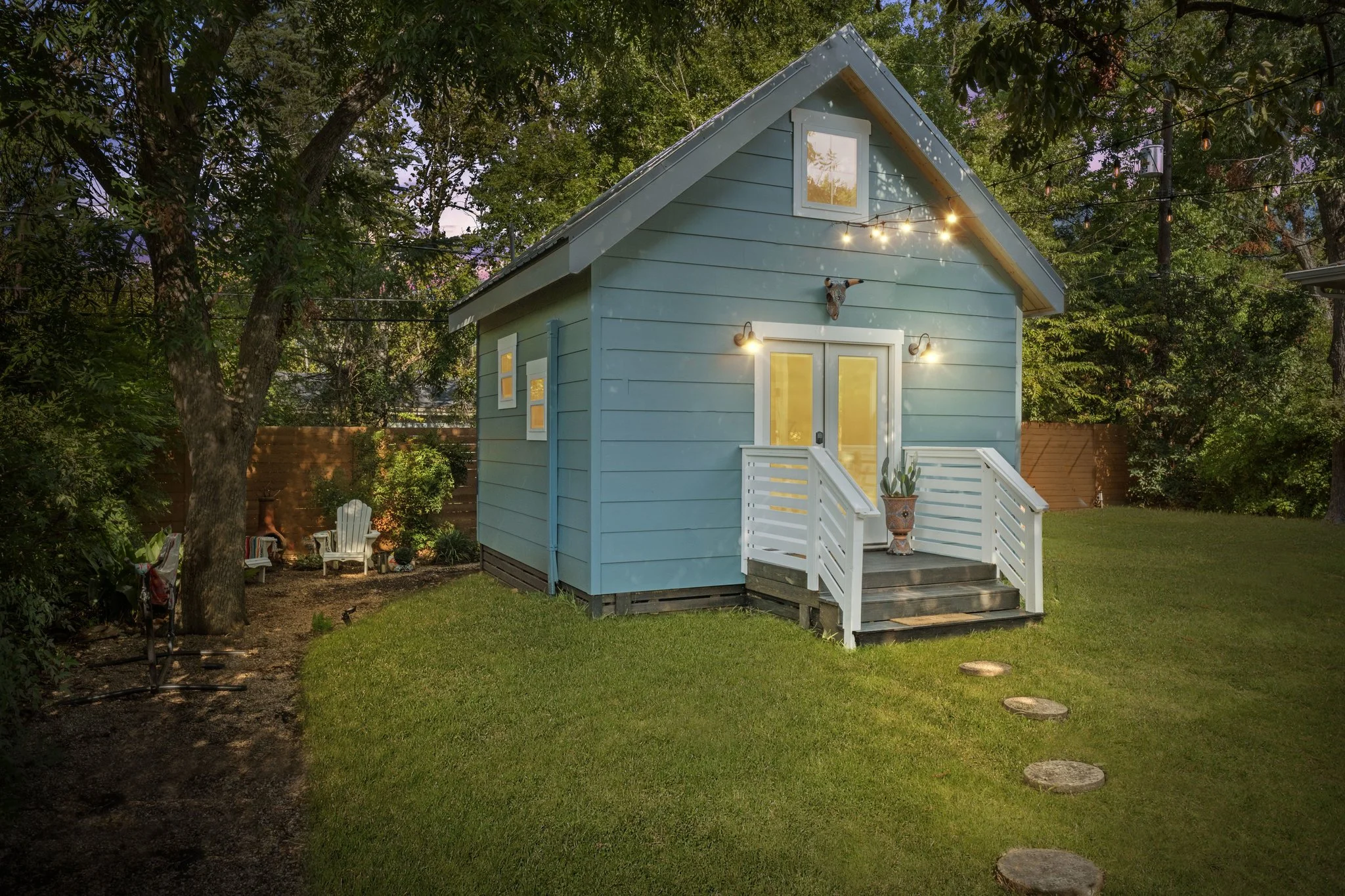Exterior with seating area to the left and putting green to the right
