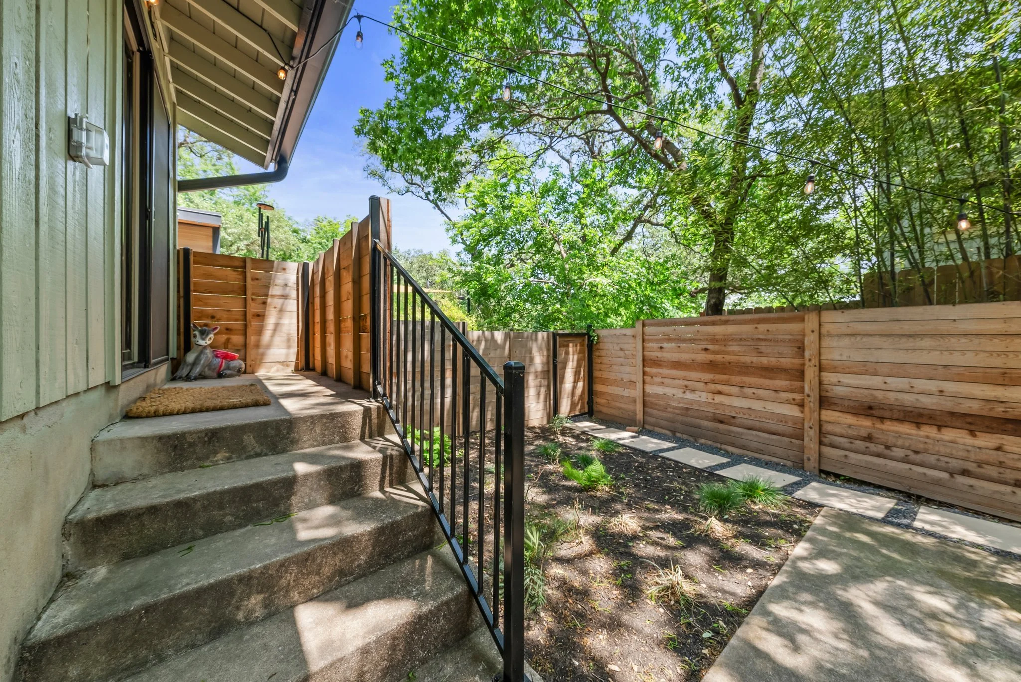 Steps from kitchen area to backyard space
