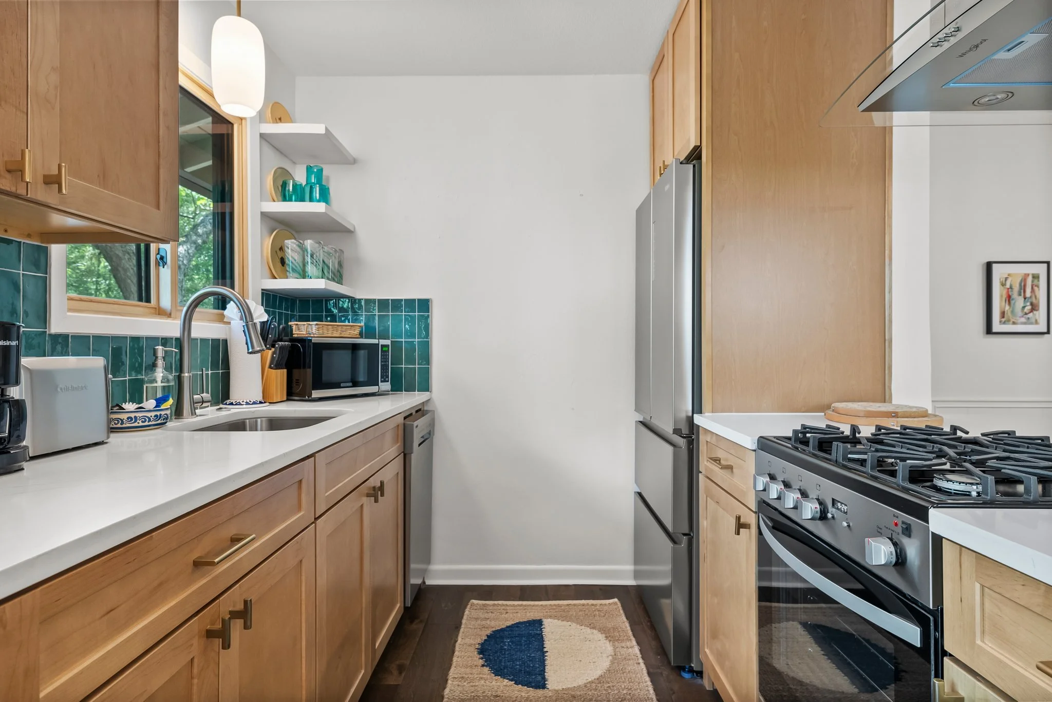 Full kitchen. Coffee maker, hot water tea kettle, toaster, dishes and silverware, baking sheet, dishwasher, refrigerator, freezer, stove, toaster, microwave, wine glasses, cleaning products