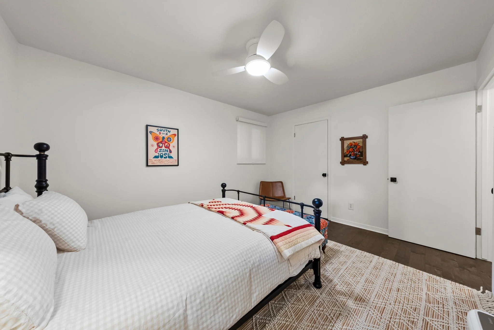 Queen bed, extra pillows and blankets, clothing storage, bed linens, hangers, ceiling fan, air conditioning, room darkening shades