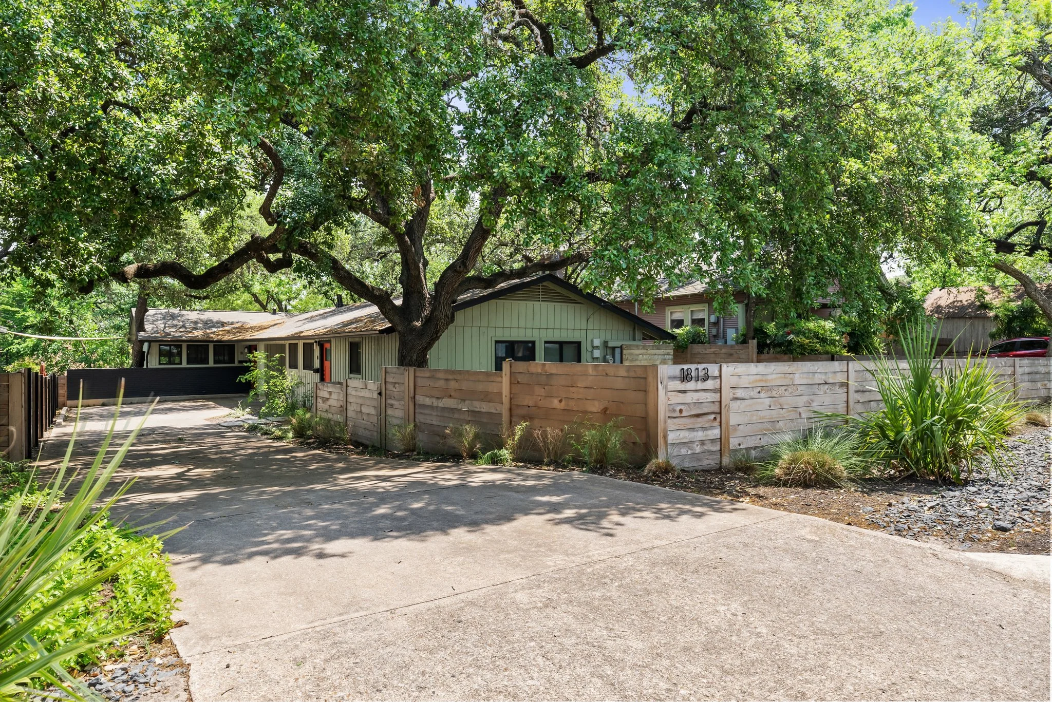 View of driveway from street to entrance