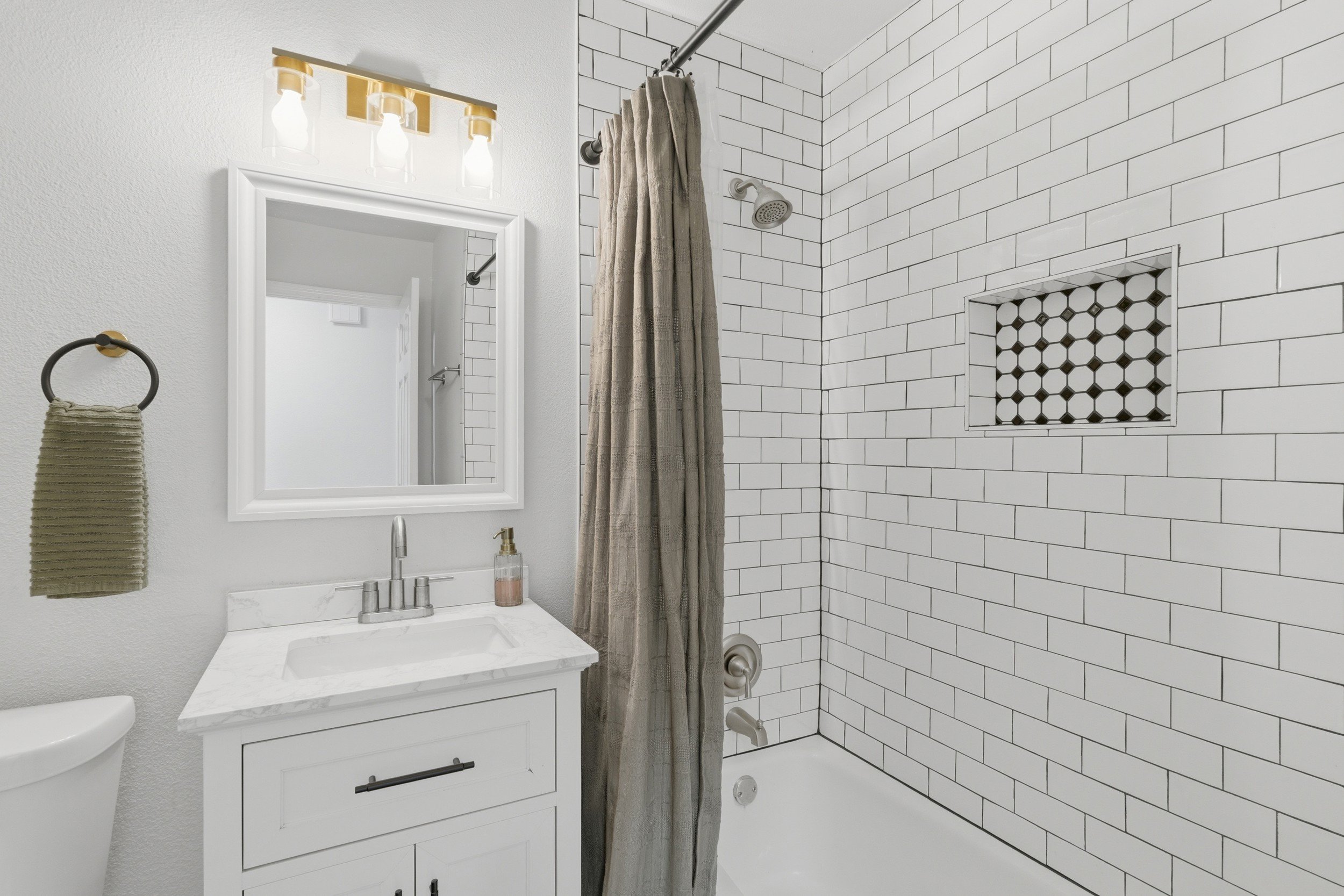 Full bathroom located in hall
