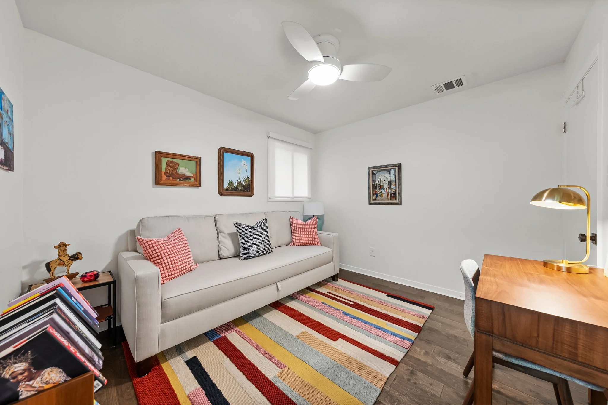 Dedicated workspace, double (size) sofa bed, bed linens, ceiling fan, books and reading material, room darkening shades