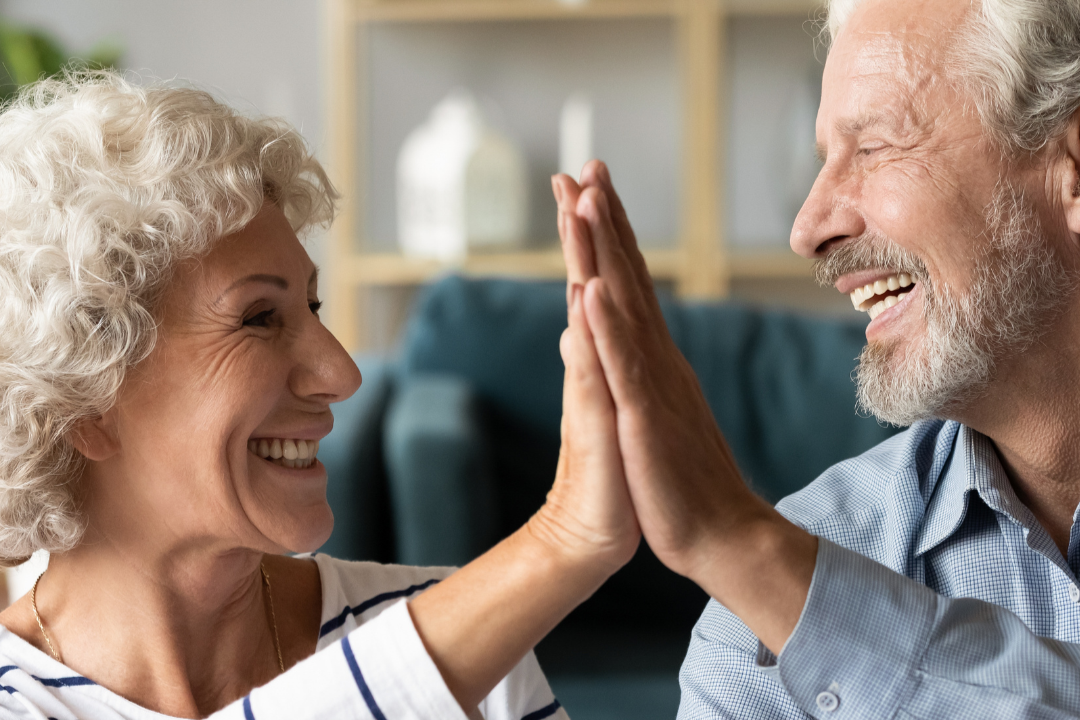 Senior couple high fiving